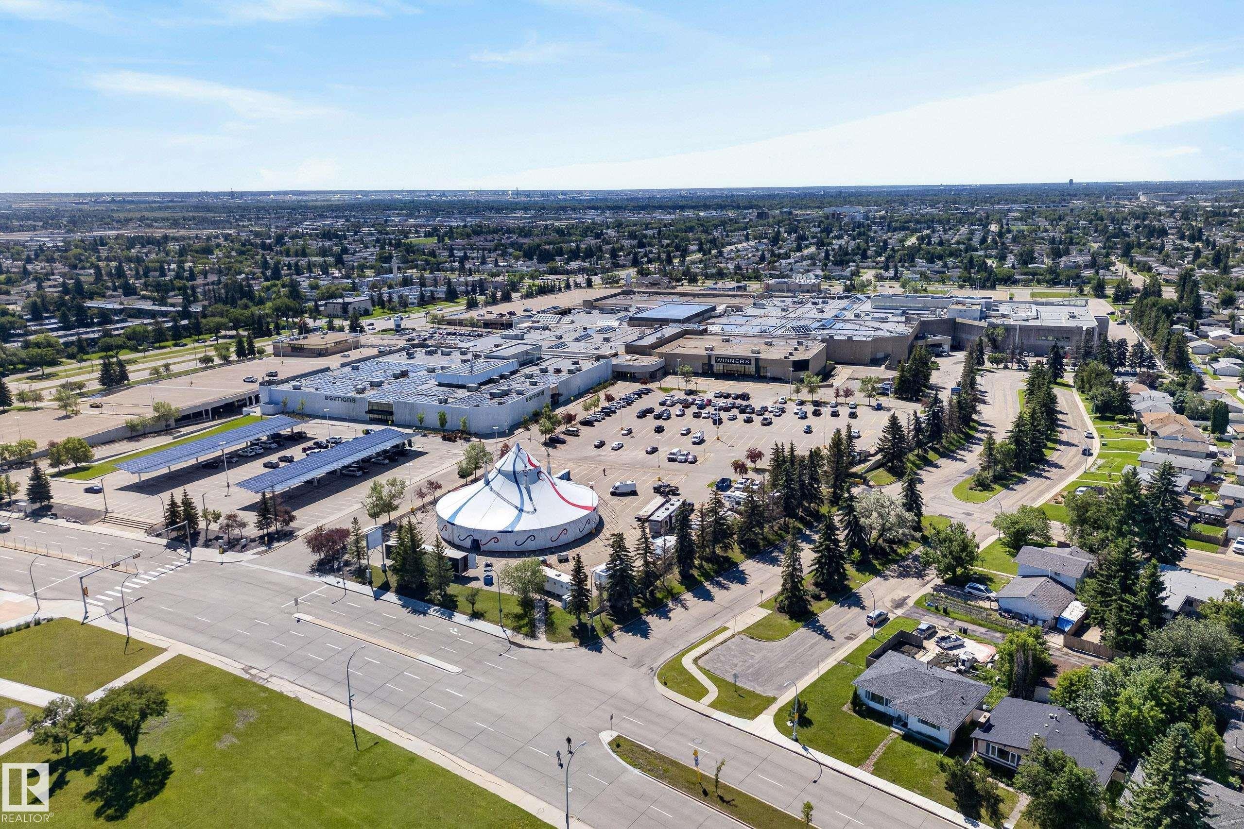 Aerial perspective showcasing a large commercial complex with extensive parking areas - 14128 73 Street, Edmonton, AB