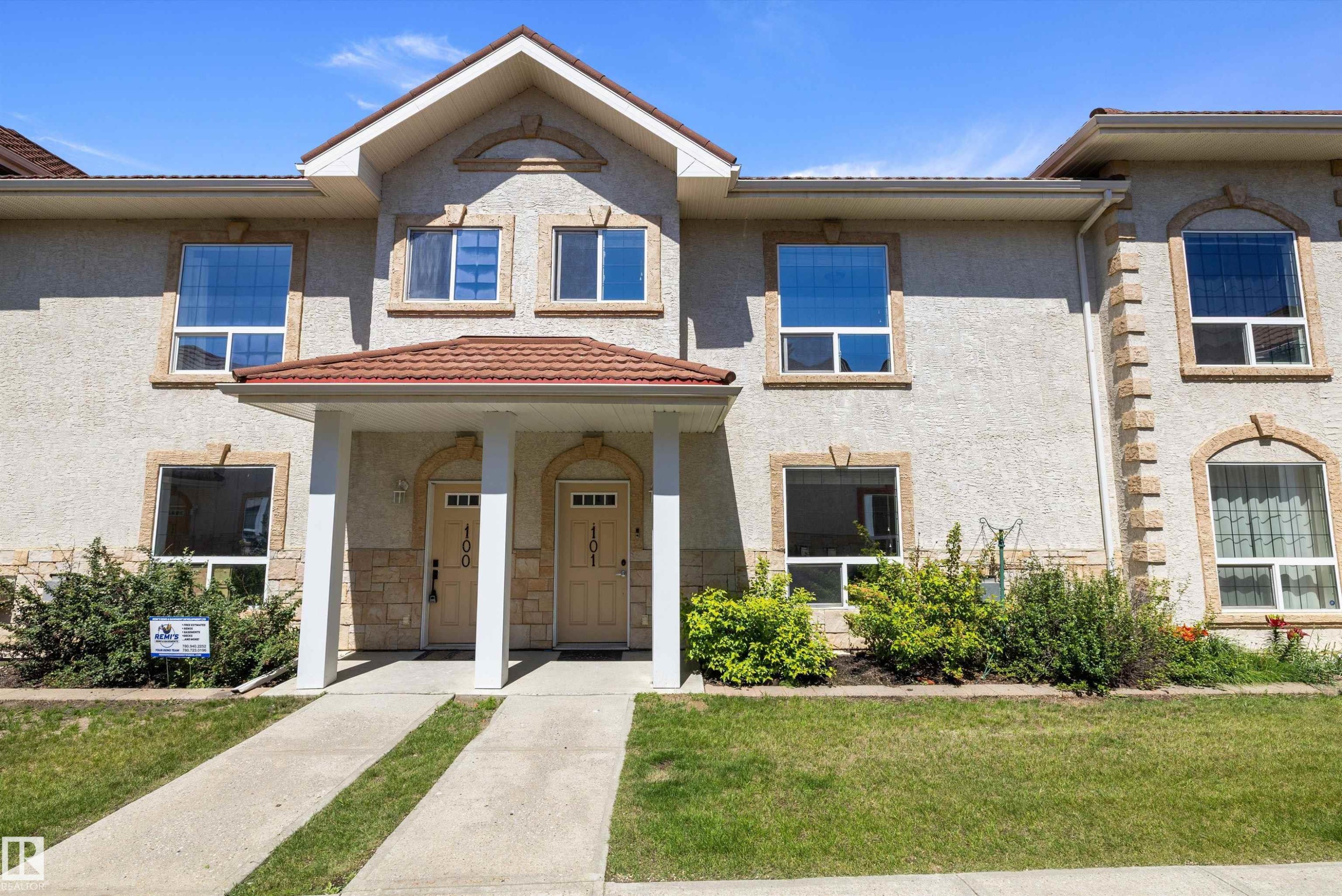 Multi-unit property with stucco exterior and prominent individual entryways - 101 13825 155 Avenue, Edmonton, AB