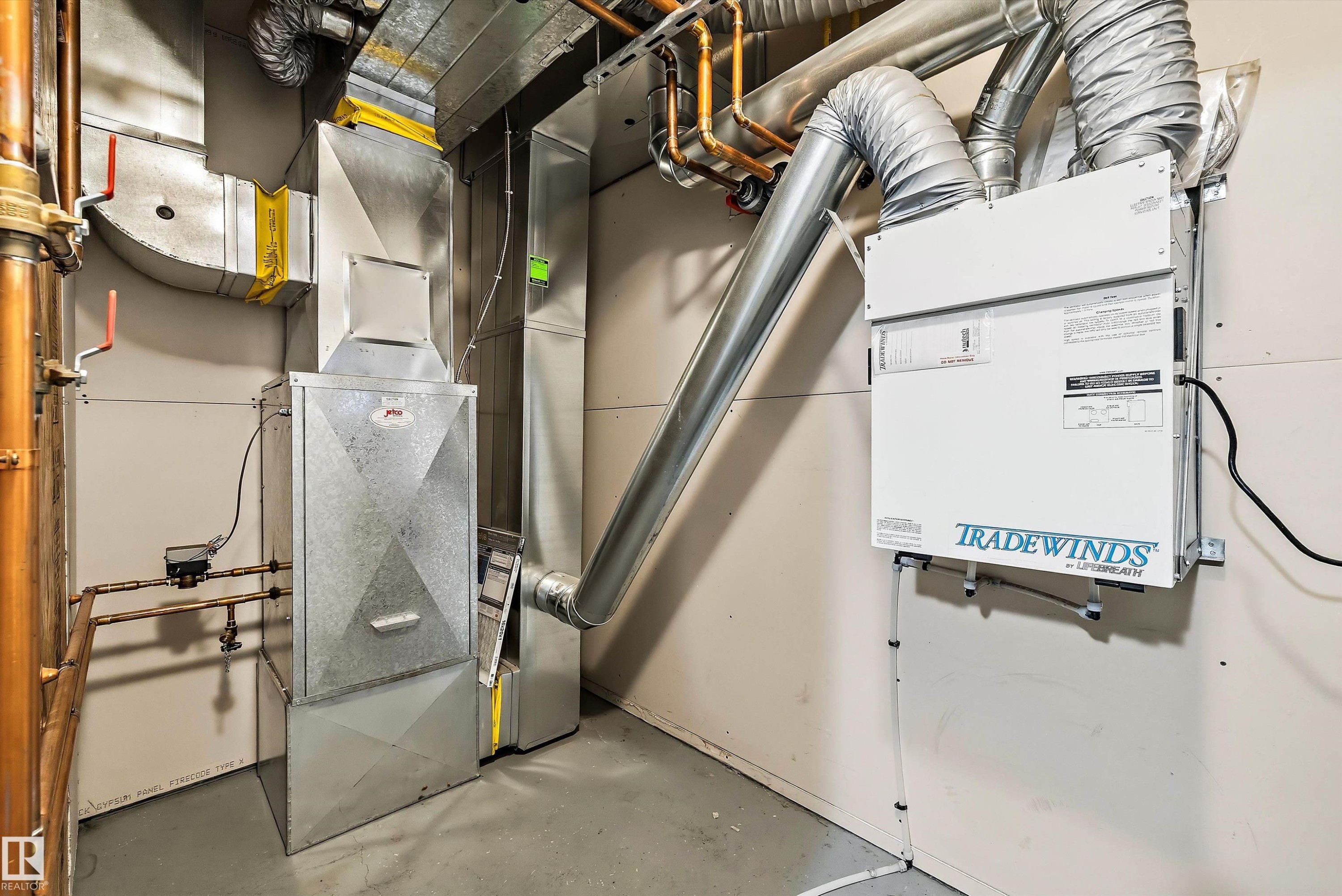 HVAC system with extensive ductwork, a forced-air furnace, copper piping, and a "Tradewinds by Lifebreath" air exchanger - 101 13825 155 Avenue, Edmonton, AB