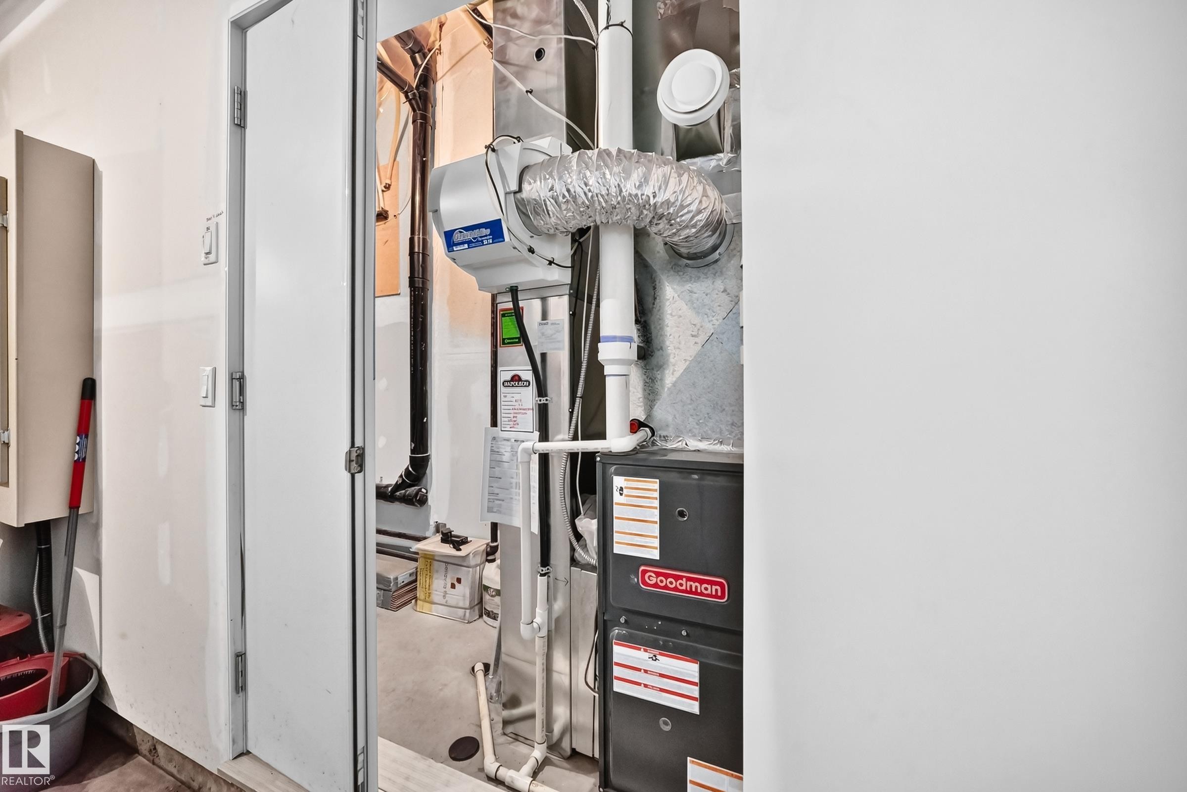 Utility room featuring a Goodman furnace and a whole-house humidifier - 37 13003 132 Avenue Nw, Edmonton, AB