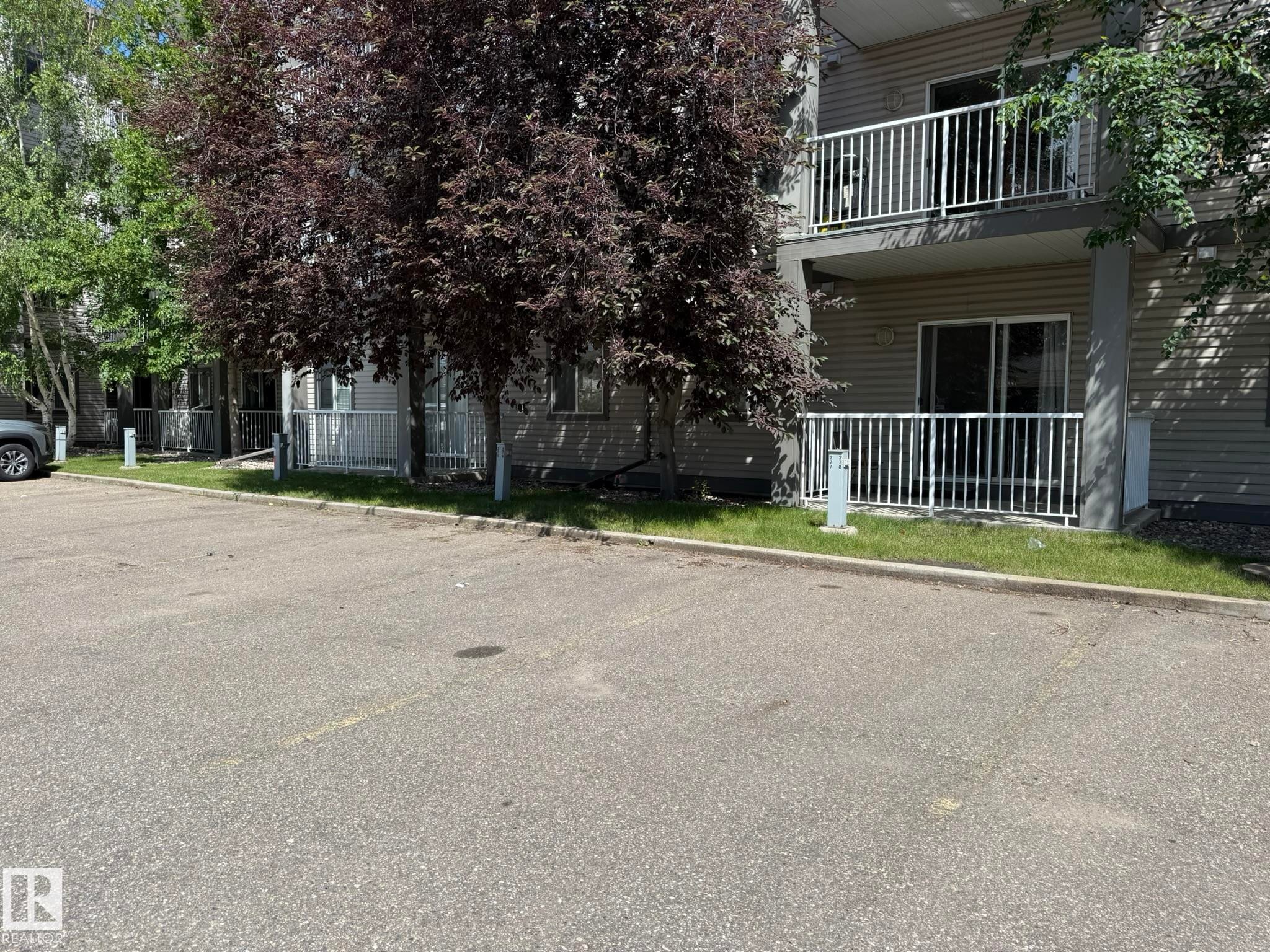 PHOTO OF YOUR #278 PARKING STALL...JUST OUTSIDE TO THE LEFT OF THE BACK DOOR ENTRANCE! AND BELOW YOUR UNIT #205! - 205 3425 19 Street, Edmonton, AB