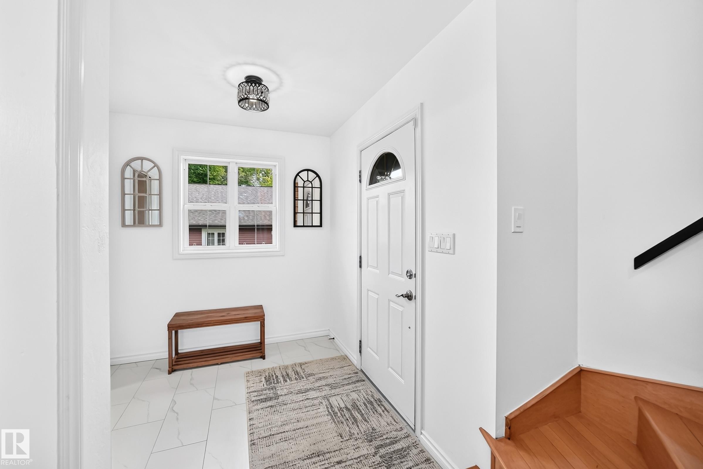 Bright entryway featuring white walls and tile flooring - 10323 138 Street Nw, Edmonton, AB - Indoor Photo Showing Other Room