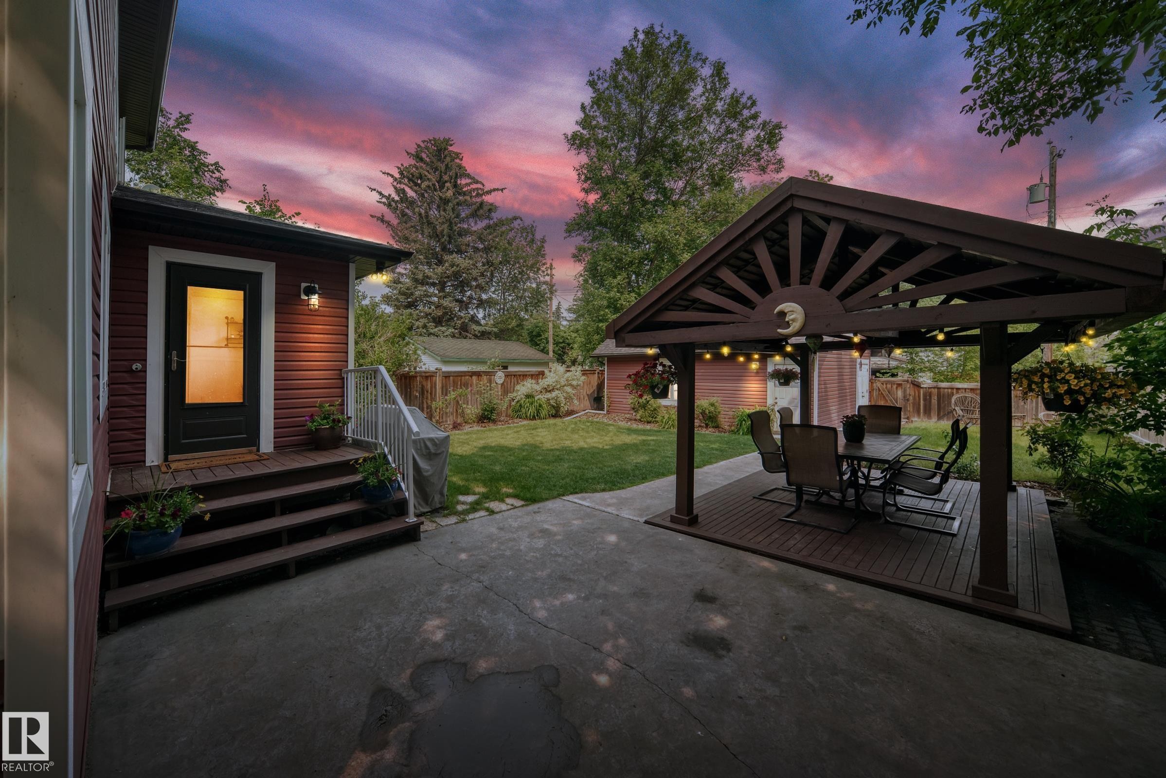 Covered outdoor living space featuring a wood-finish pergola - 10323 138 Street Nw, Edmonton, AB - Outdoor