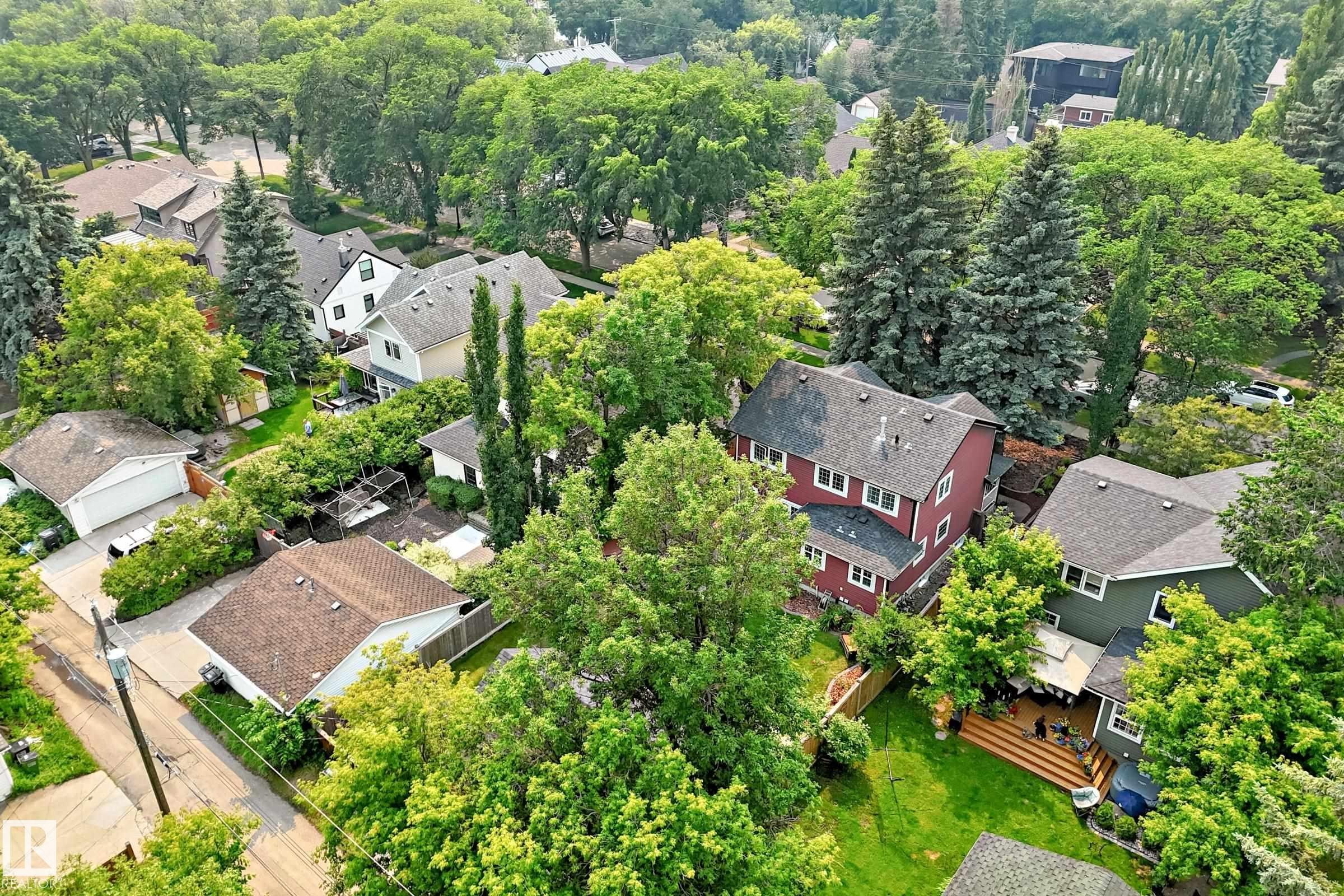 Residential setting featuring mature trees and a variety of architectural styles - 10323 138 Street Nw, Edmonton, AB - Outdoor
