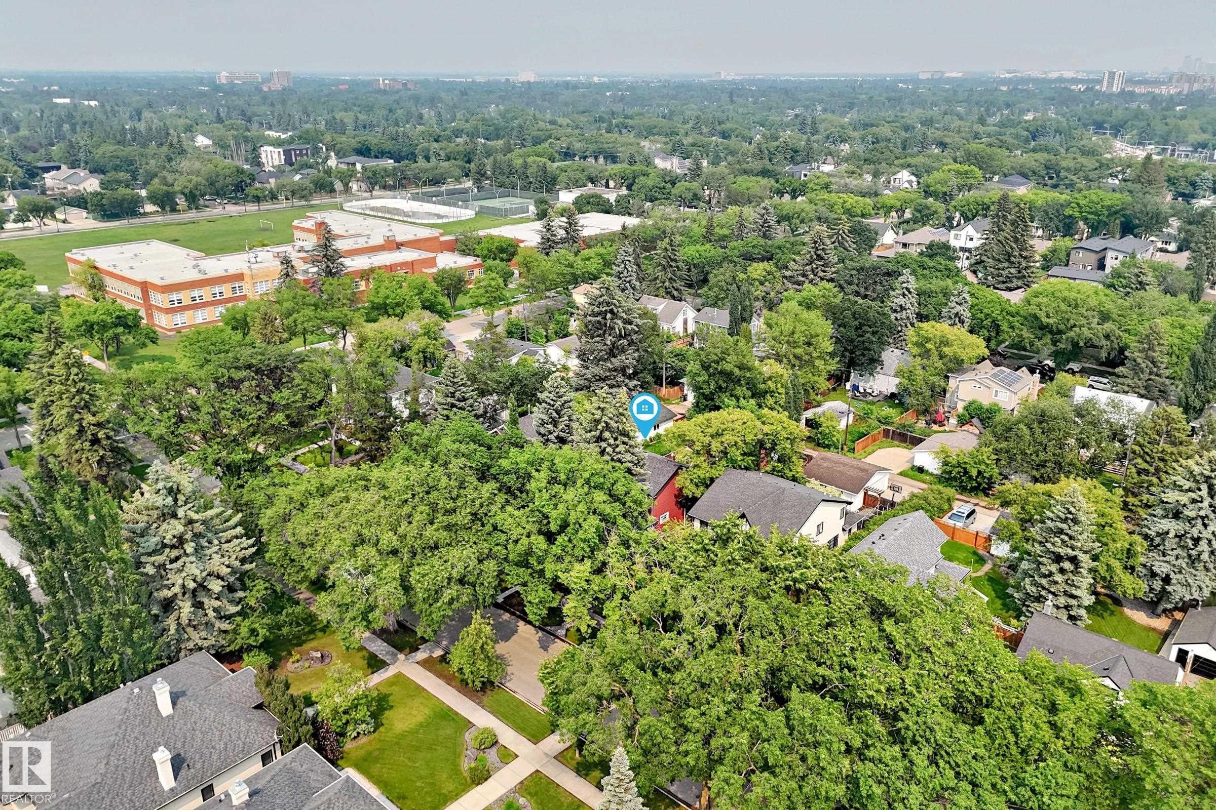 Expansive aerial view of a residential neighborhood featuring numerous mature trees - 10323 138 Street Nw, Edmonton, AB - Outdoor With View