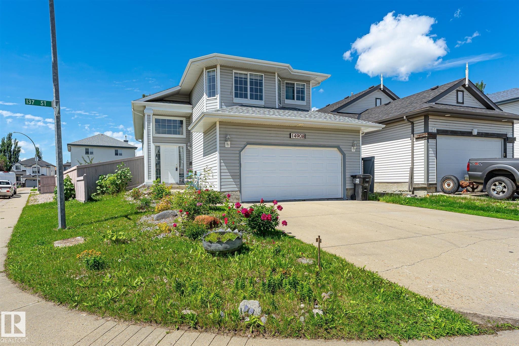 Contemporary two-story residence featuring light gray siding and an attached two-car garage - 14908 137 Street Nw, Edmonton, AB - Outdoor With Facade