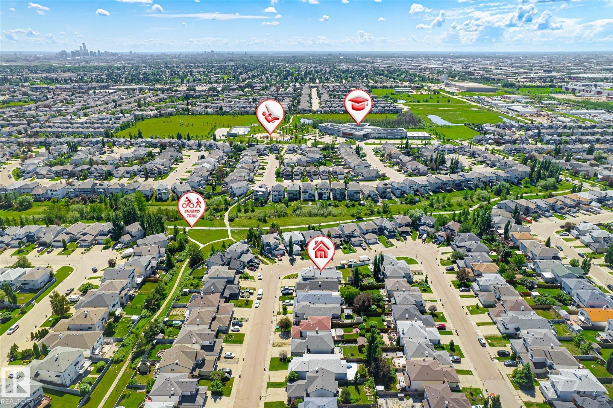 Aerial perspective showcasing a residential neighborhood with extensive green spaces and established streetscapes - 14908 137 Street Nw, Edmonton, AB - Outdoor With View