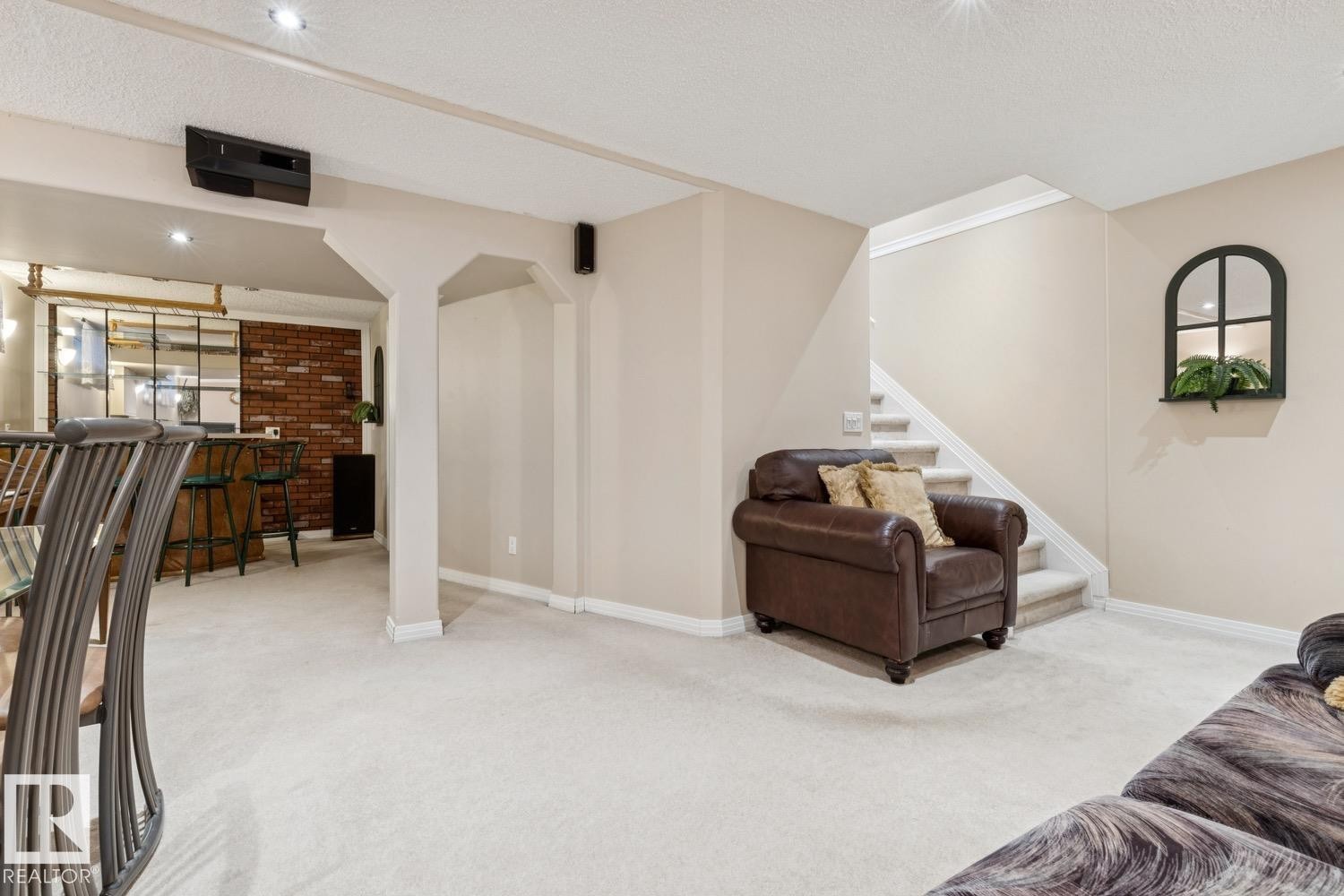 Spacious lower-level area featuring light-colored carpeting and recessed lighting - 3015 131 Avenue, Edmonton, AB