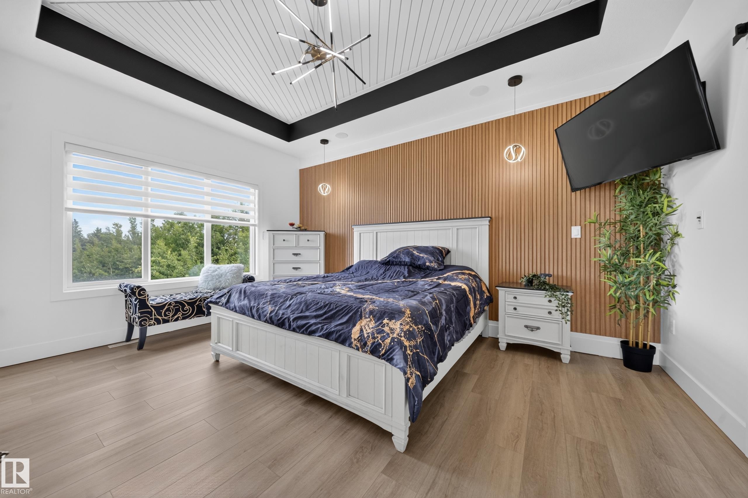 Vaulted ceiling with white paneling and a modern linear chandelier - 626 Astoria Way, Devon, AB