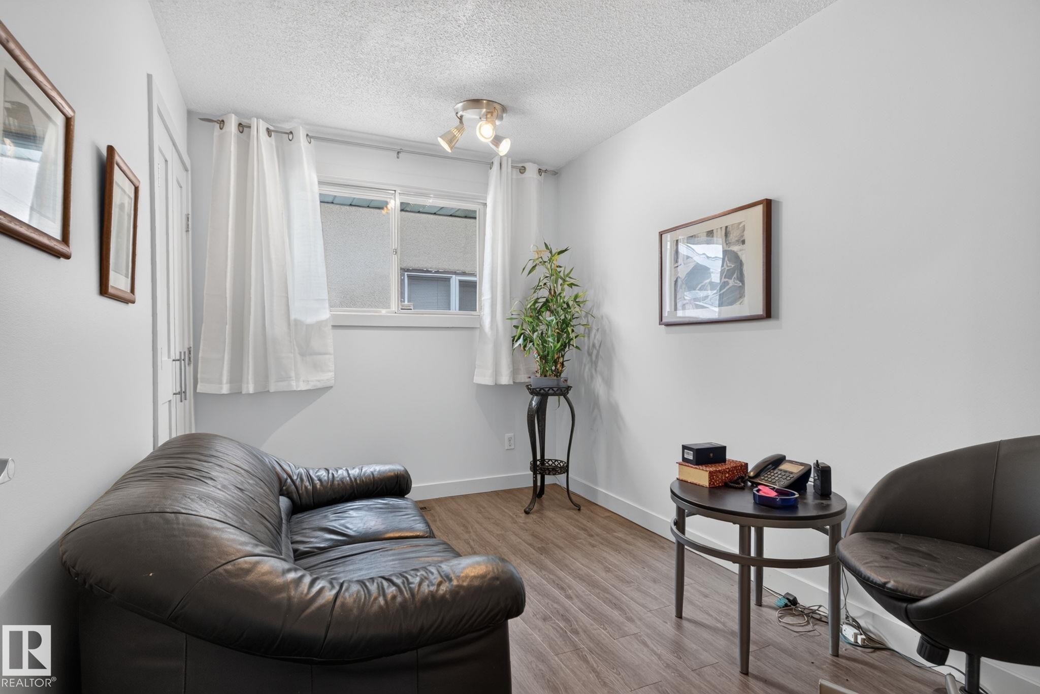 White painted walls with wood-finish flooring - 7539 149A Avenue Nw, Edmonton, AB - Indoor