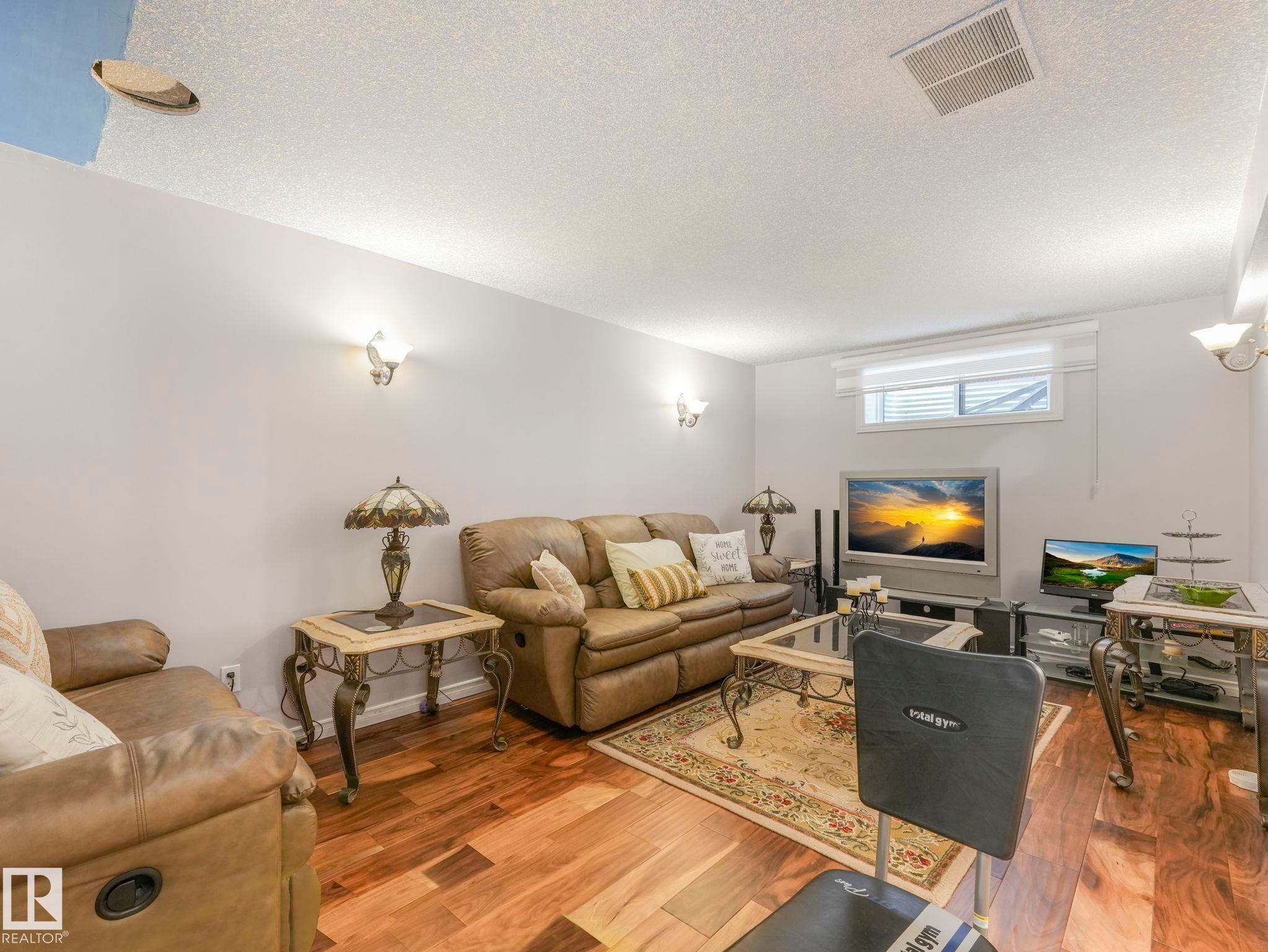 16237 129A Street Nw, Edmonton, AB - Indoor Photo Showing Living Room With Fireplace
