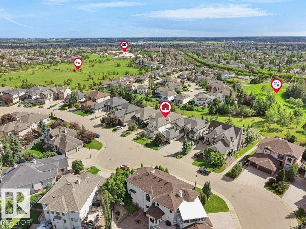 Aerial perspective showcasing a residential community with varied architectural styles and mature landscaping - 2423 Tegler Green, Edmonton, AB