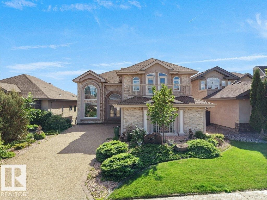 Grand residence featuring a stone and stucco exterior - 2423 Tegler Green, Edmonton, AB