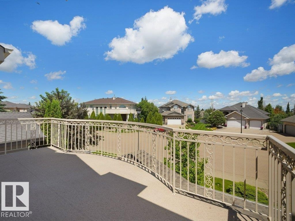 Expansive outdoor balcony featuring a decorative metal railing and a durable surface - 2423 Tegler Green, Edmonton, AB