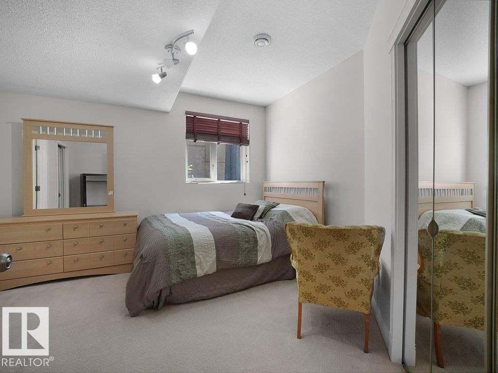 Bedroom featuring light-colored carpeting and white painted walls - 2423 Tegler Green, Edmonton, AB