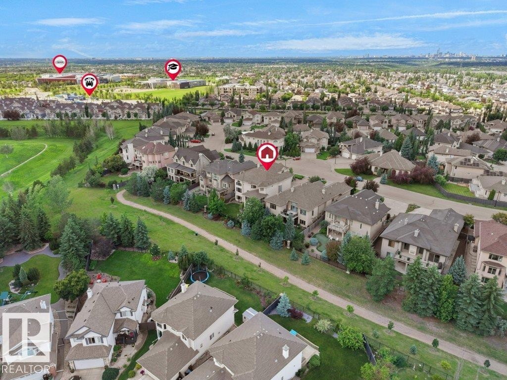 Aerial representation of a residential area featuring multiple detached properties with pitched roofs and established landscaping - 2423 Tegler Green, Edmonton, AB