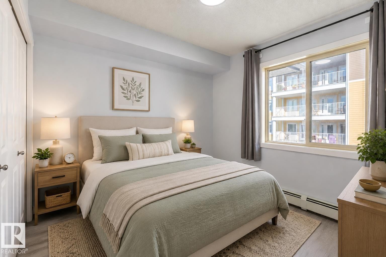 Bedroom featuring wood-finish flooring, a double-door closet, and a large window - 403 25 Element Dr, St. Albert, AB - Indoor Photo Showing Bedroom