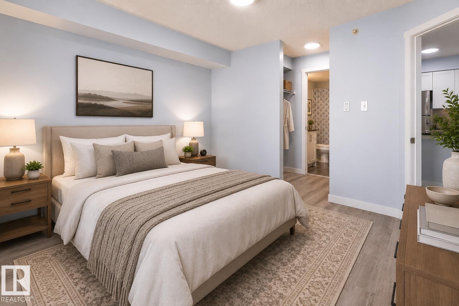 Bedroom featuring wood-finish flooring, a neutral-toned upholstered headboard, and dual built-in overhead lighting fixtures - 403 25 Element Dr, St. Albert, AB - Indoor Photo Showing Bedroom