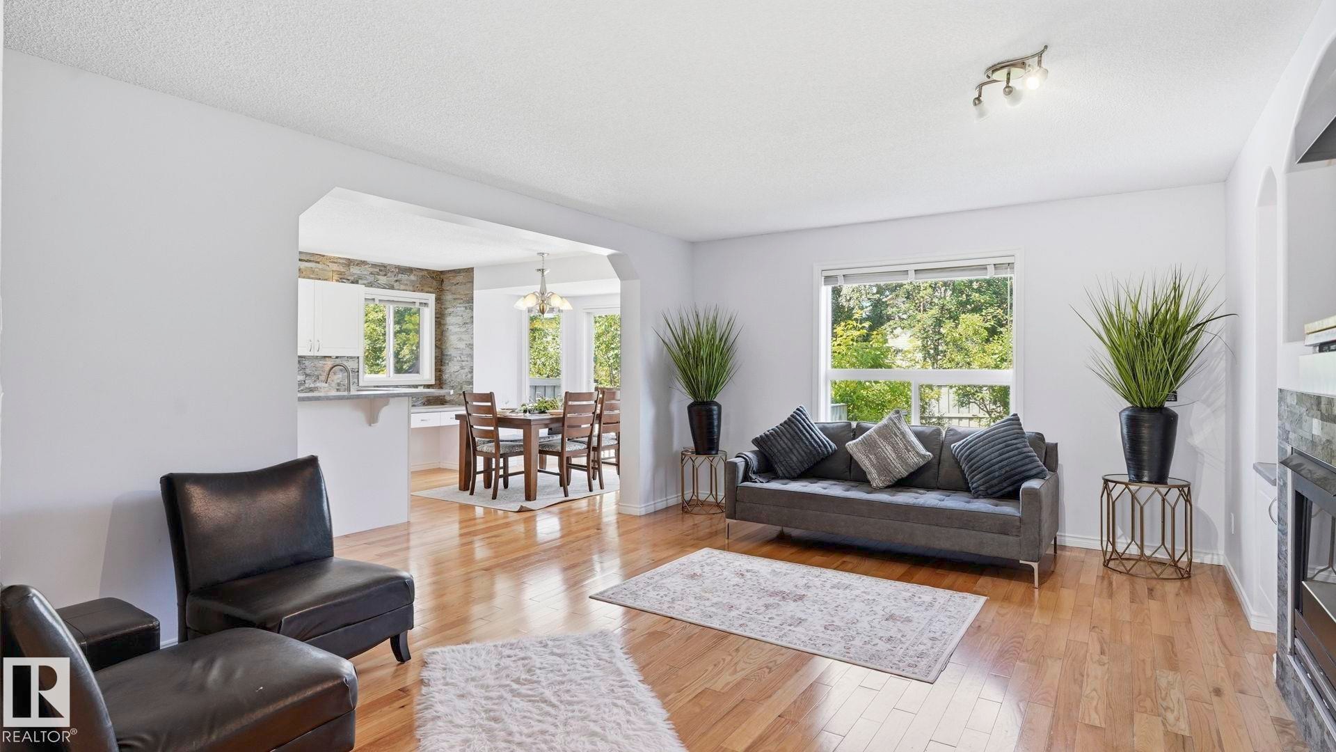 Hardwood-style flooring throughout living space - 3591 Mclean Crescent, Edmonton, AB