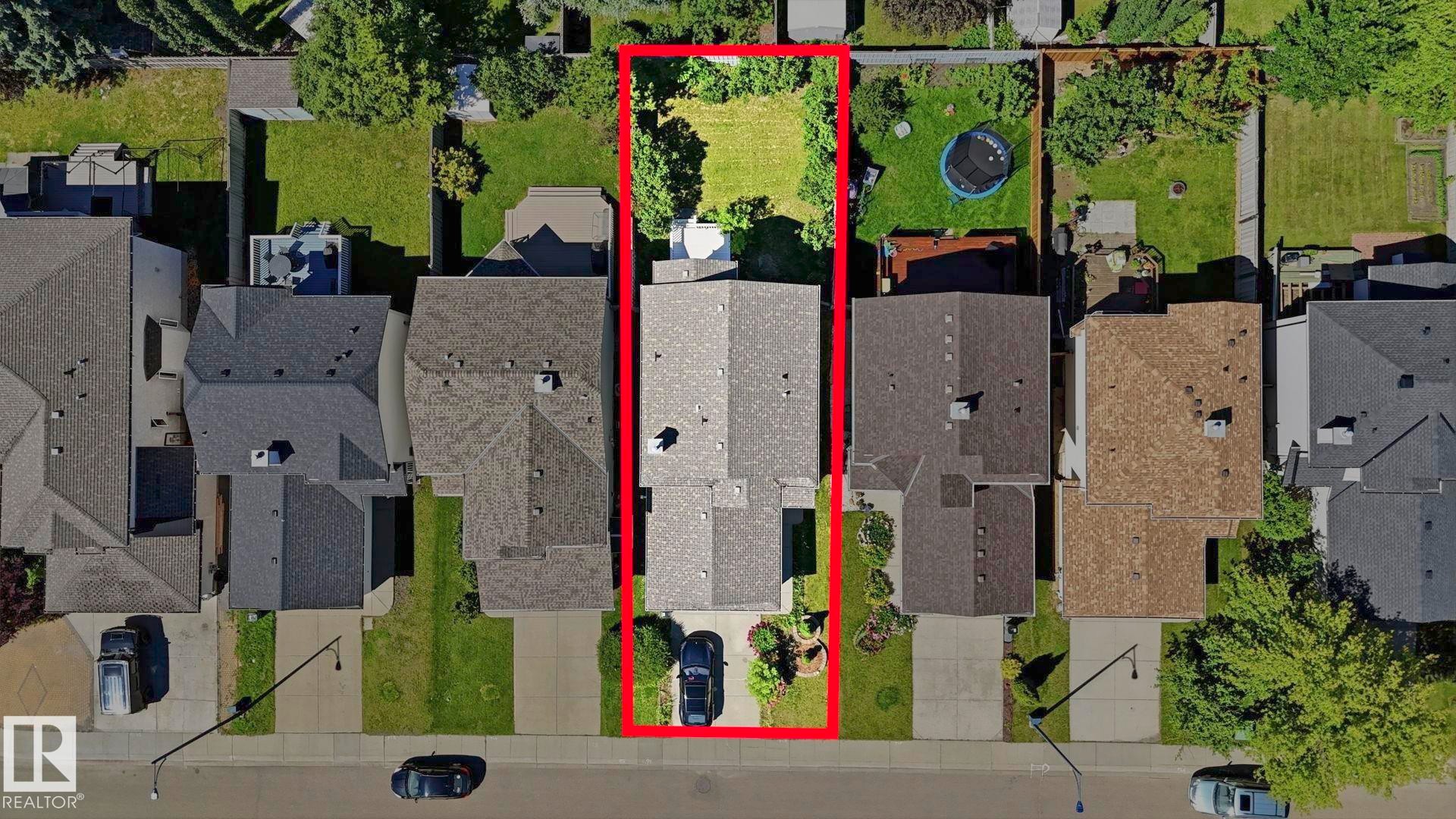 Aerial perspective showcasing the property's rectangular lot with a grey-shingled roofline - 3591 Mclean Crescent, Edmonton, AB