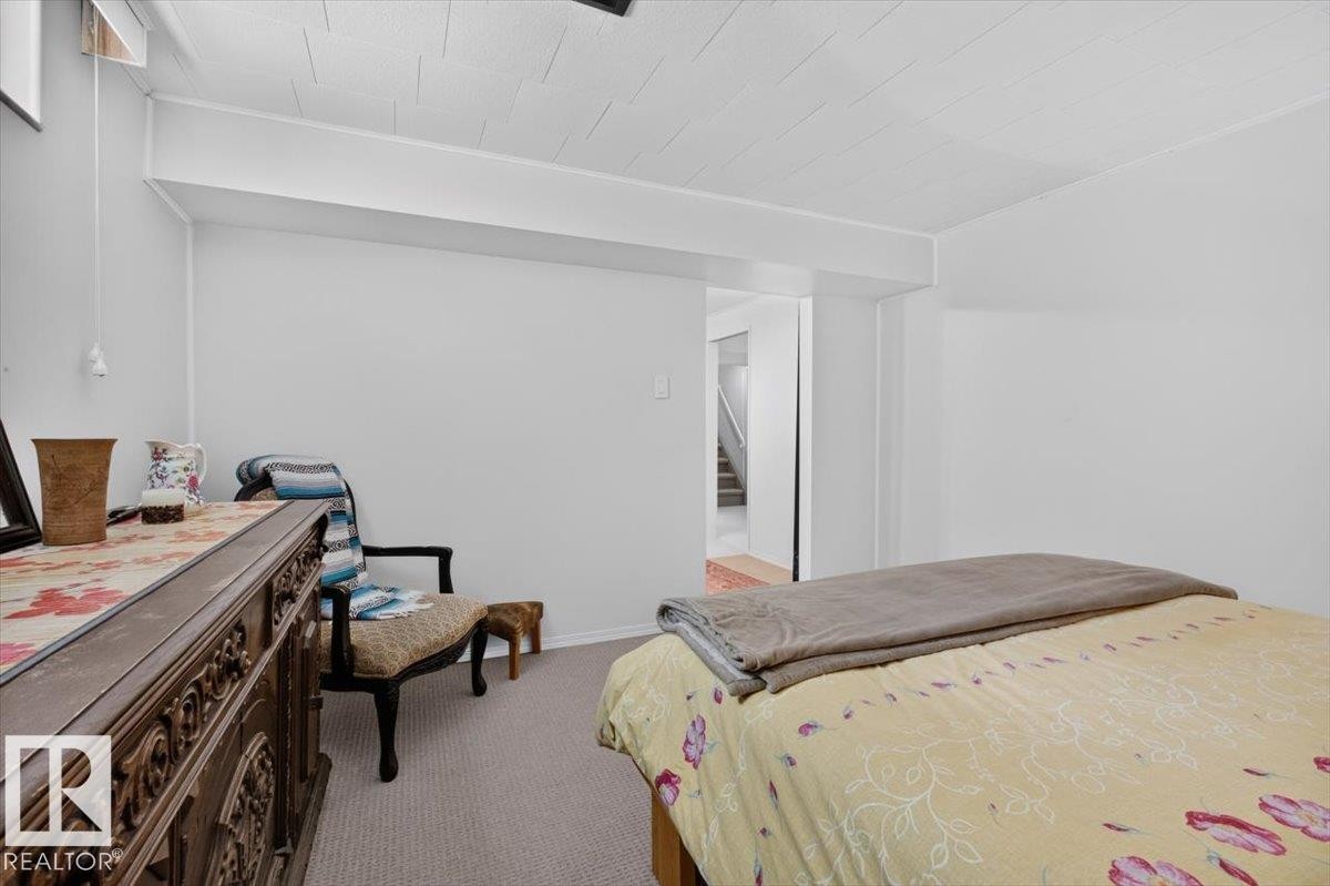 Carpeted room with white walls and a white ceiling - 10736 48 Street Nw, Edmonton, AB - Indoor Photo Showing Bedroom