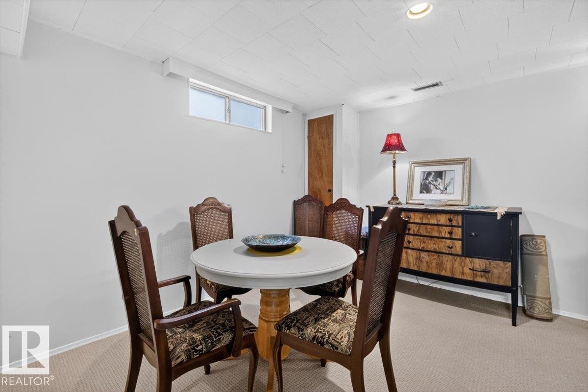Recessed ceiling lighting illuminates the space - 10736 48 Street Nw, Edmonton, AB - Indoor Photo Showing Dining Room