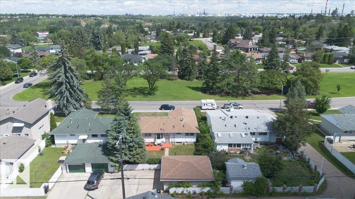 Aerial perspective showcasing a residential area with varied housing styles - 10736 48 Street Nw, Edmonton, AB - Outdoor With View