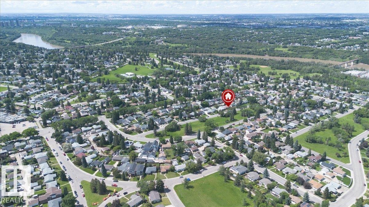 Aerial perspective showcasing an established residential neighborhood with mature trees and green spaces - 10736 48 Street Nw, Edmonton, AB - Outdoor With View