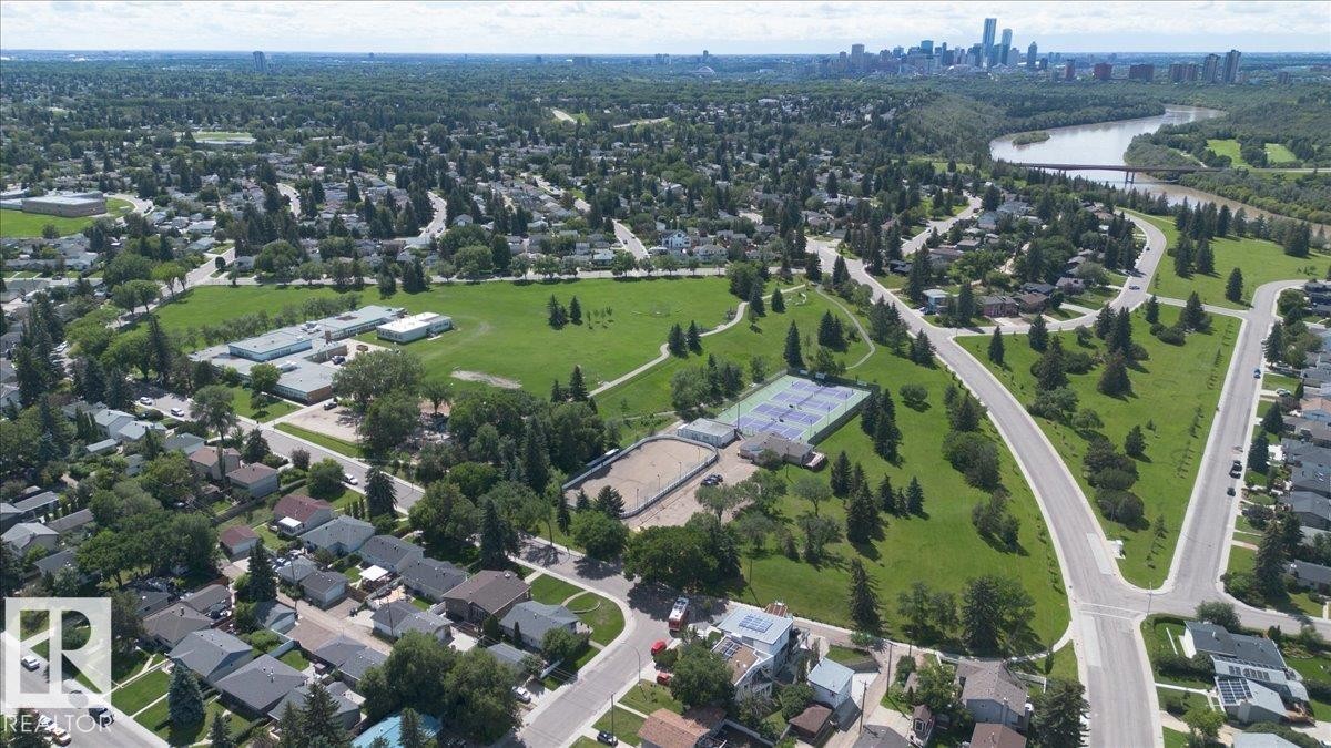 Aerial perspective of a residential neighborhood featuring established homes and abundant green spaces - 10736 48 Street Nw, Edmonton, AB - Outdoor With View