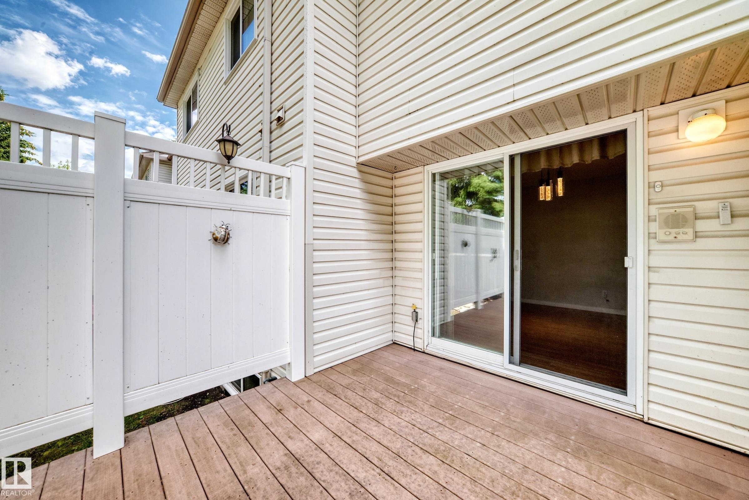 Exterior deck featuring wood-finish flooring - #51 9630 176 St Nw, Edmonton, AB - Outdoor With Deck Patio Veranda With Exterior