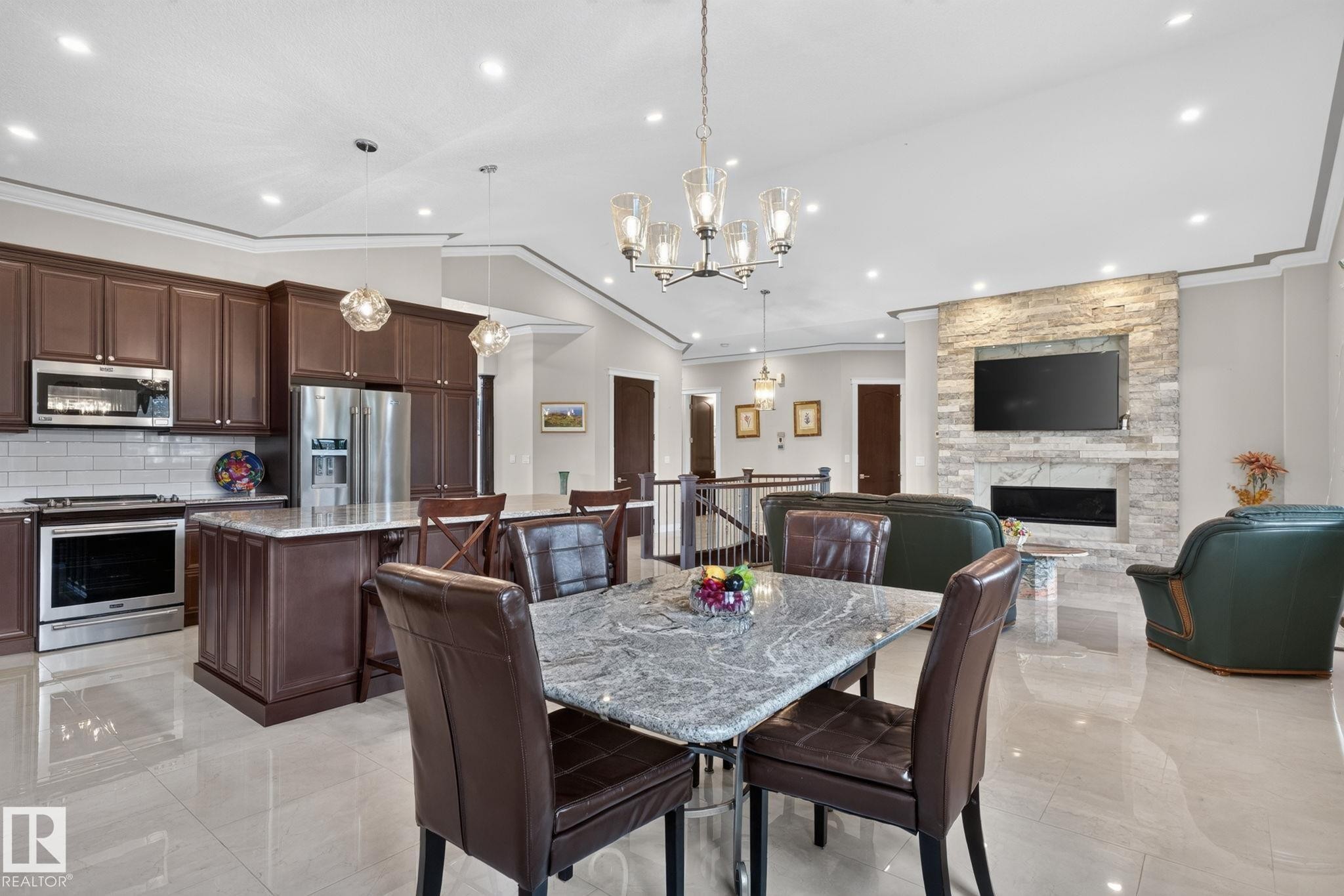 4707 Woolsey Common Sw, Edmonton, AB - Indoor Photo Showing Dining Room With Fireplace