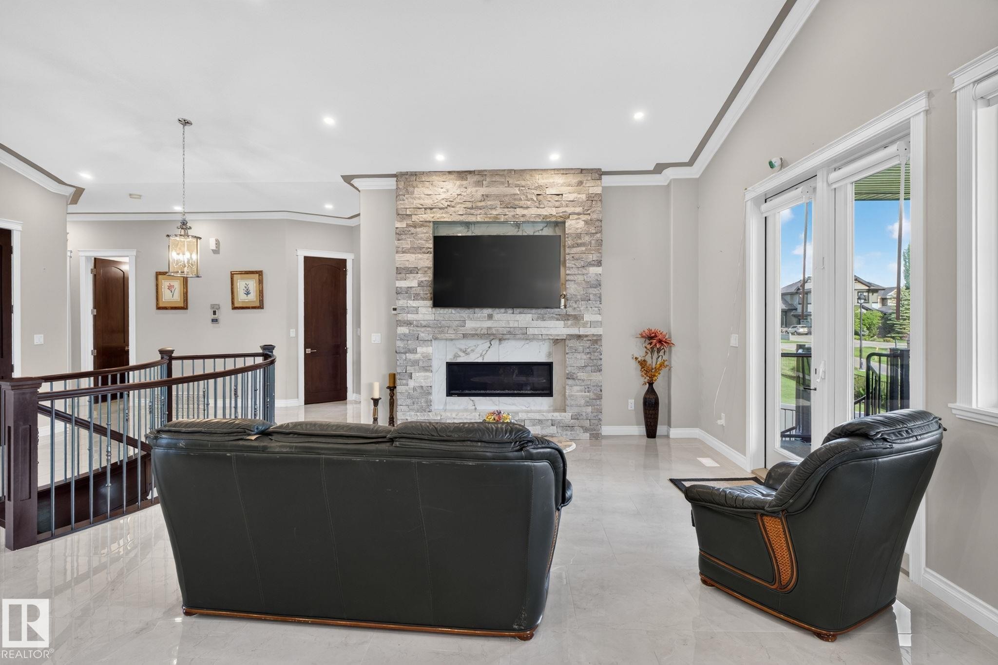 4707 Woolsey Common Sw, Edmonton, AB - Indoor With Fireplace