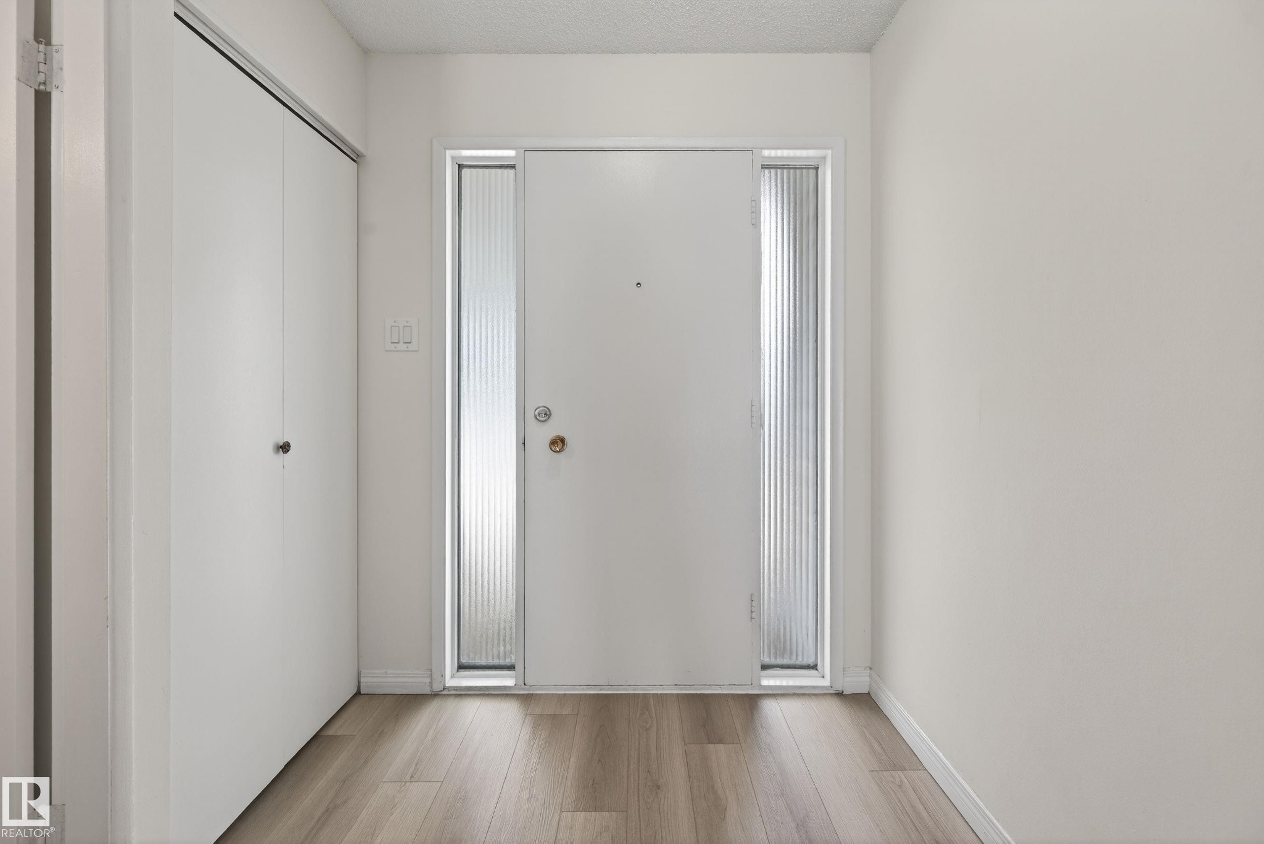 Entryway featuring a white door with two frosted glass sidelights - 156 Lee Ridge Road, Edmonton, AB - Indoor Photo Showing Other Room