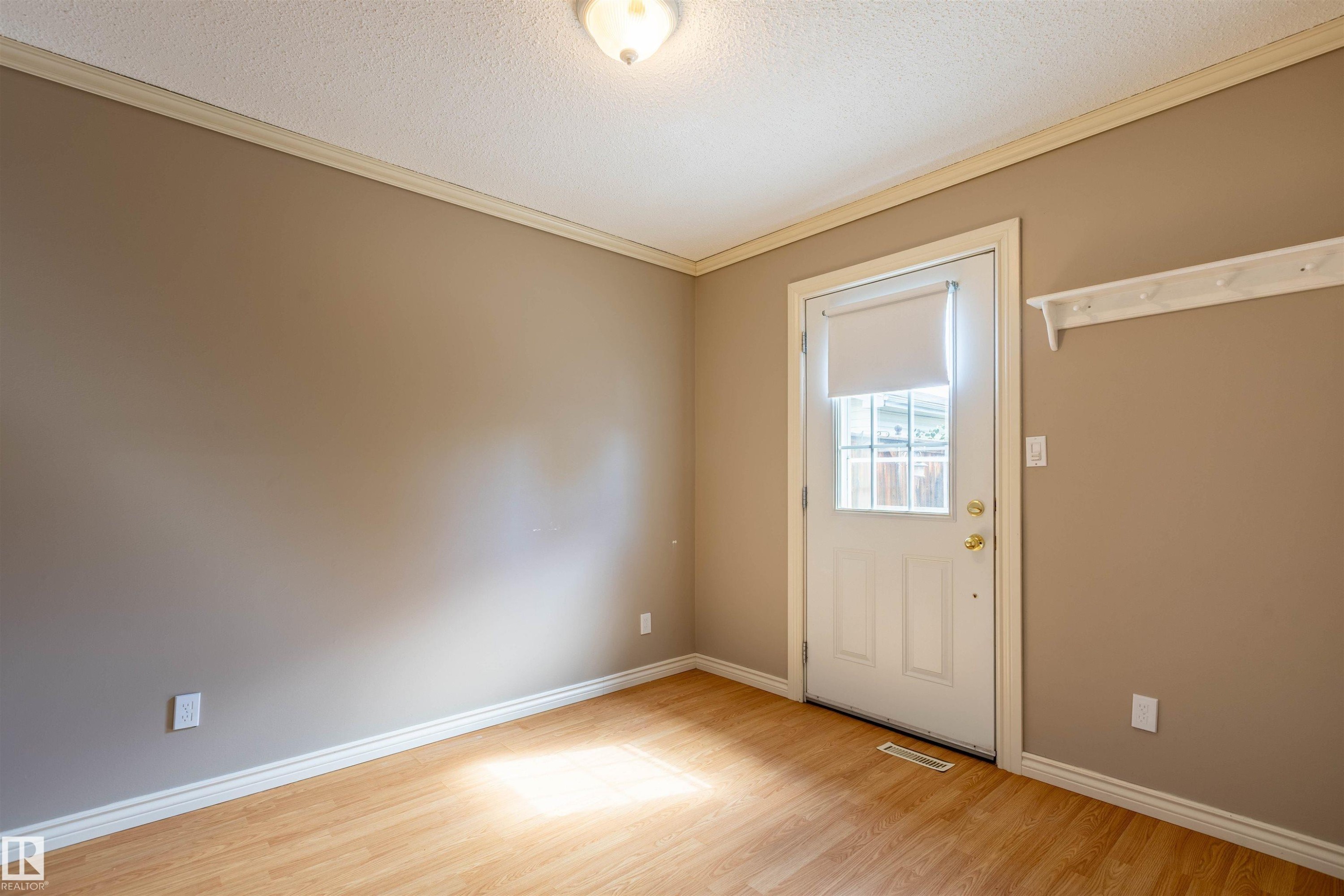 Interior room with wood-finish flooring and neutral wall tones - 3 Glenforest Crescent, Stony Plain, AB