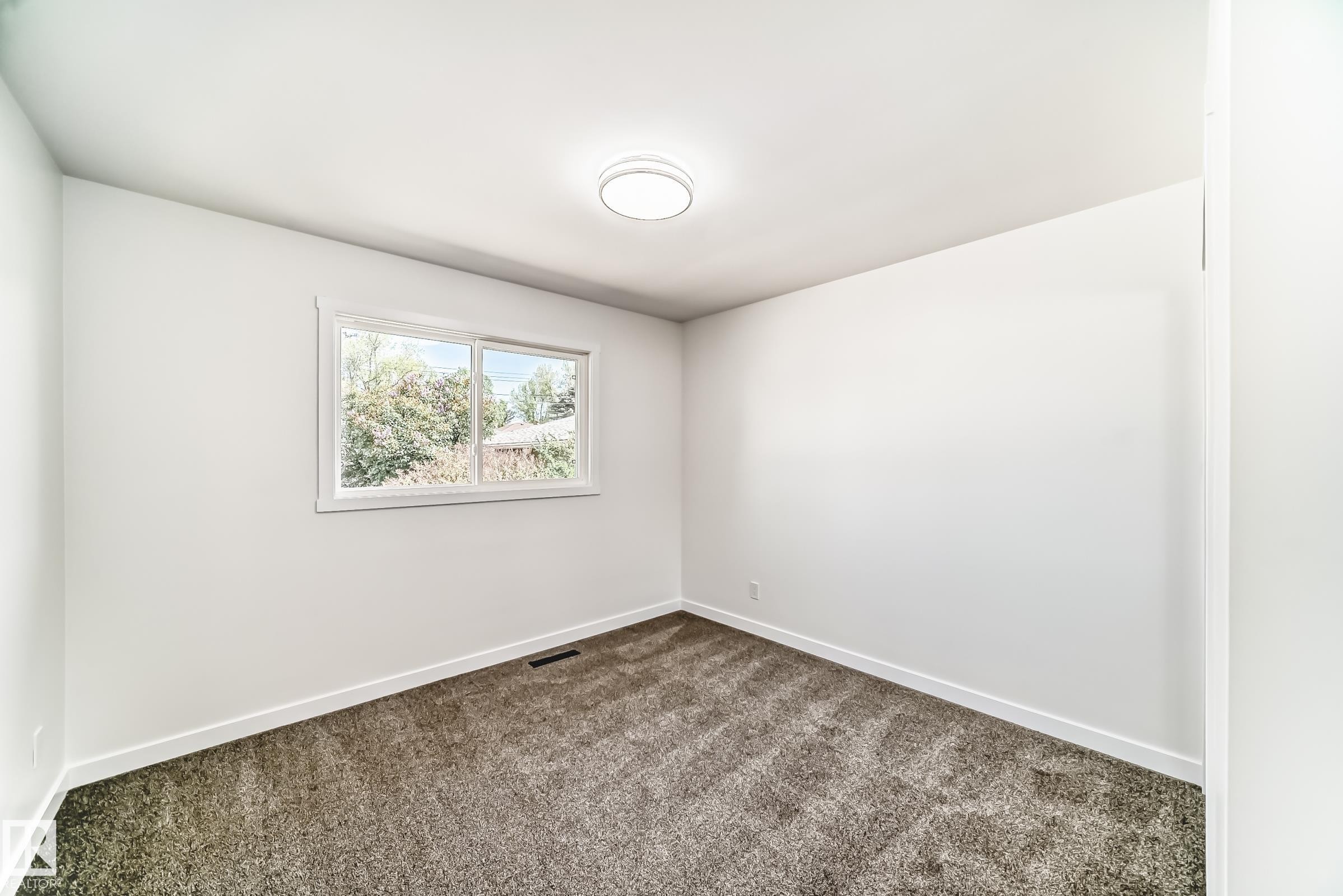 Room with light gray carpet, white walls, and white trim - 4842 116Ave, Edmonton, AB