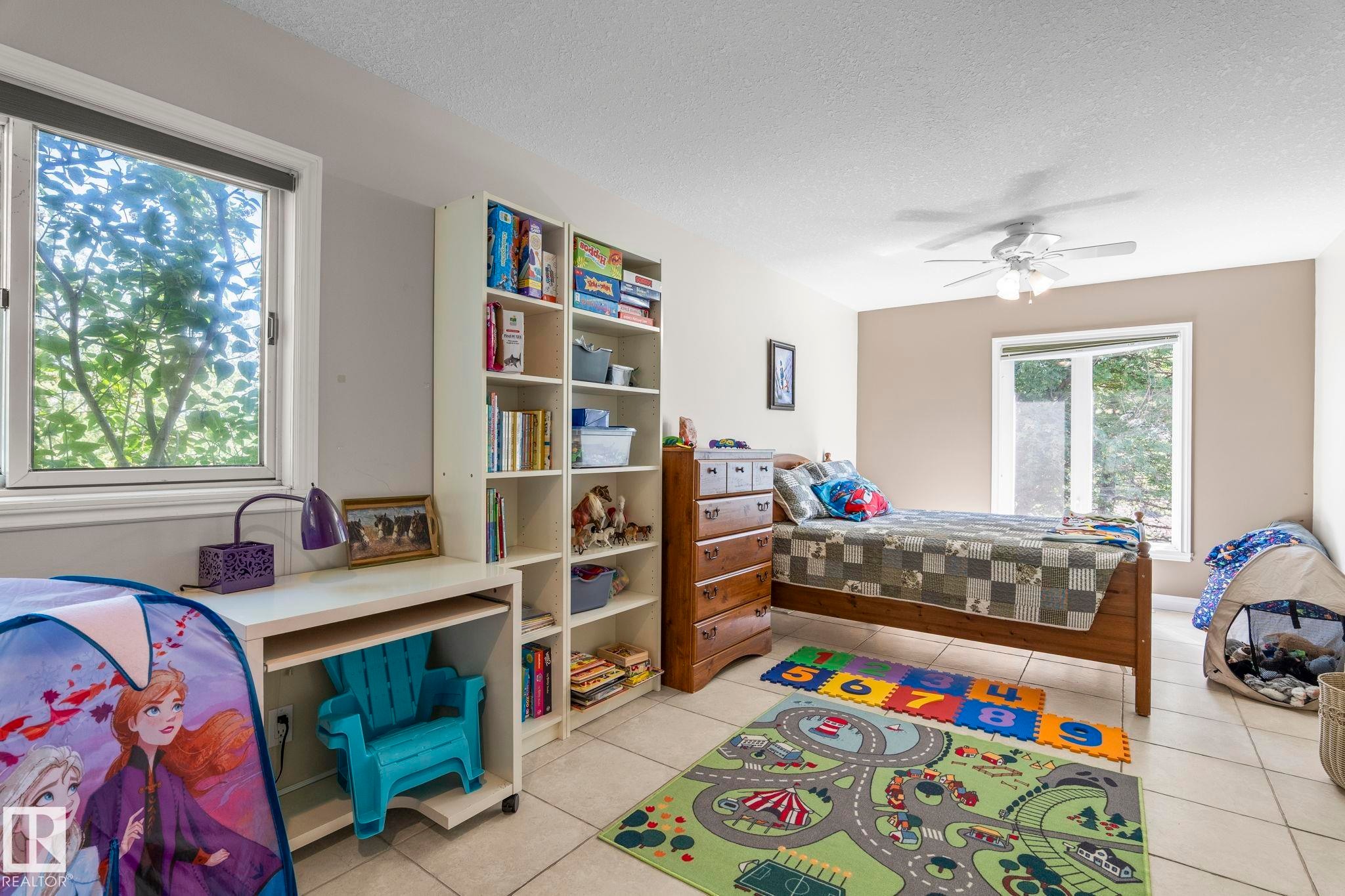 Room featuring light-toned tile flooring and neutral wall colors - 860 41 Avenue, Edmonton, AB