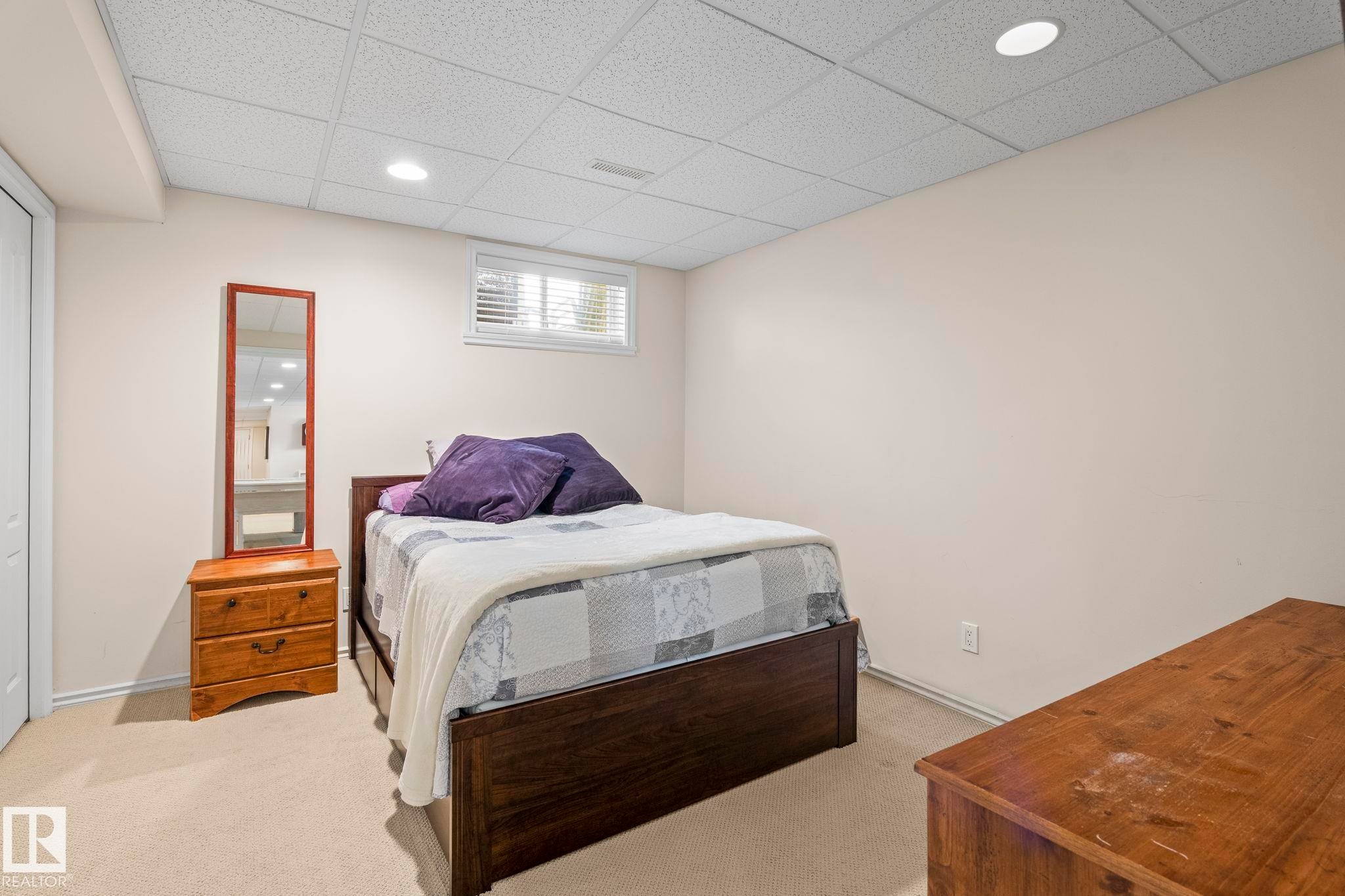 Bedroom featuring neutral wall paint, recessed lighting, and a drop ceiling - 860 41 Avenue, Edmonton, AB