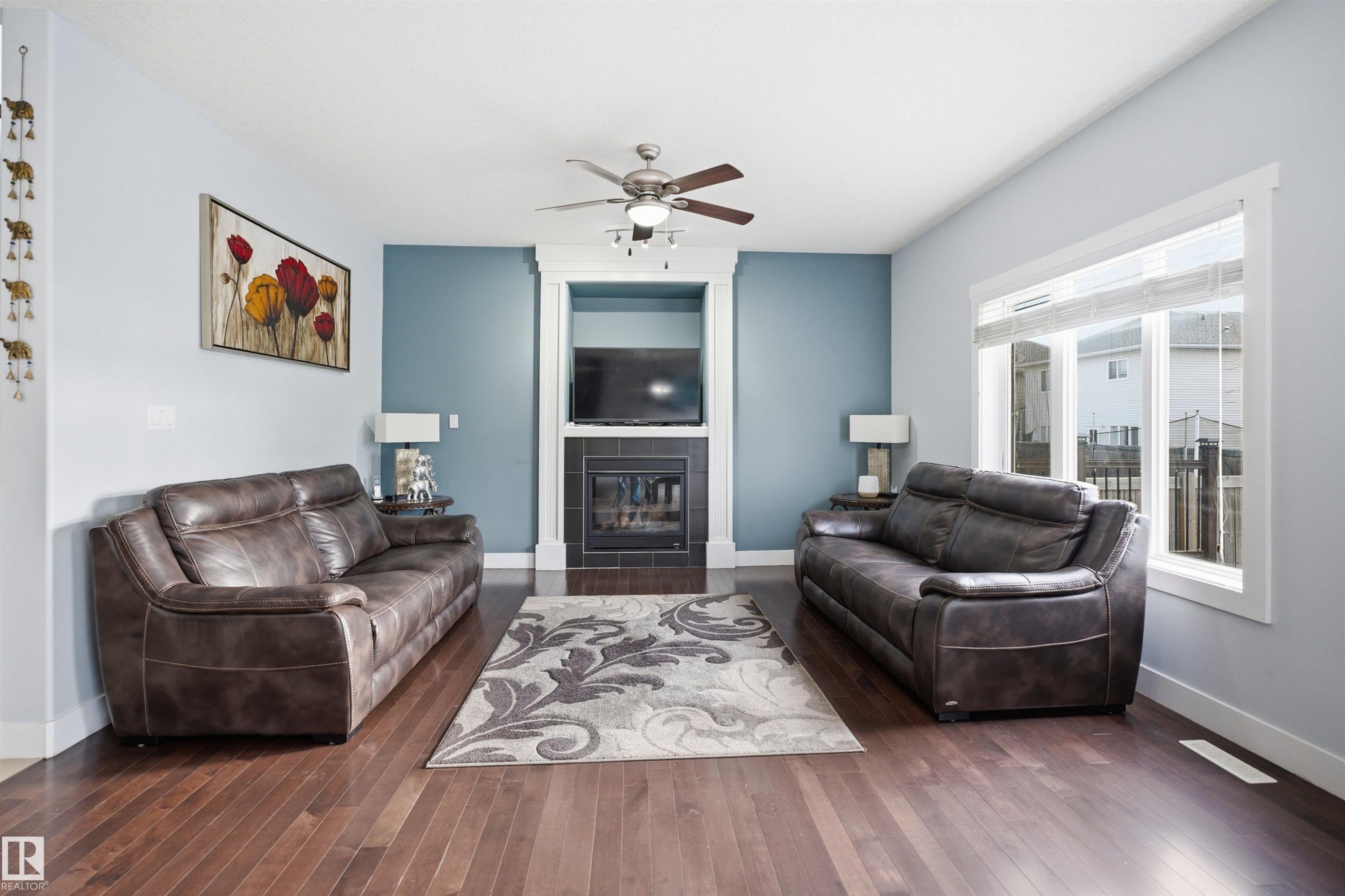 6014 60 Street, Beaumont, AB - Indoor Photo Showing Living Room With Fireplace