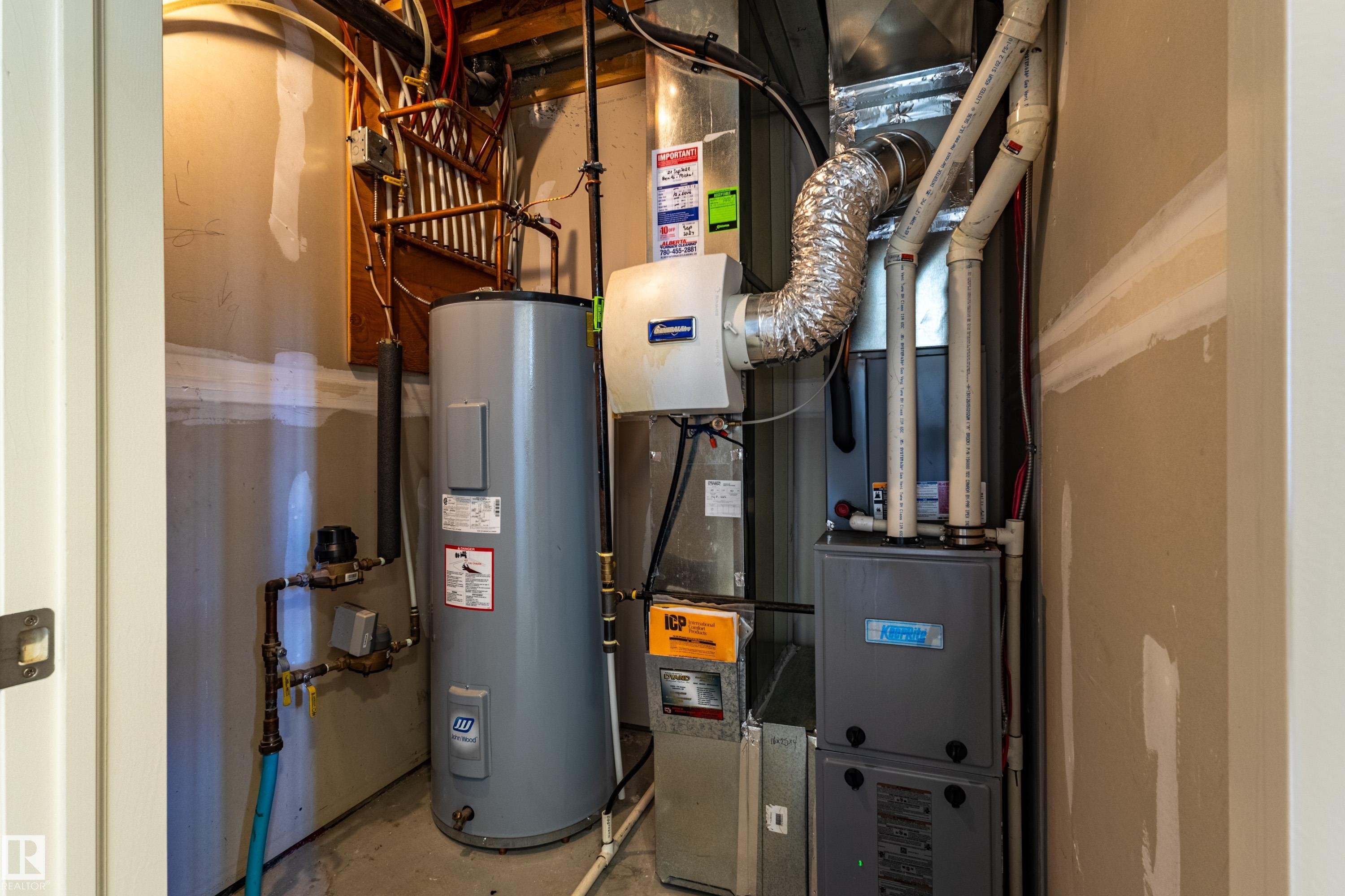 Utility space featuring water heater and HVAC system - 13 1816 Rutherford Road, Edmonton, AB