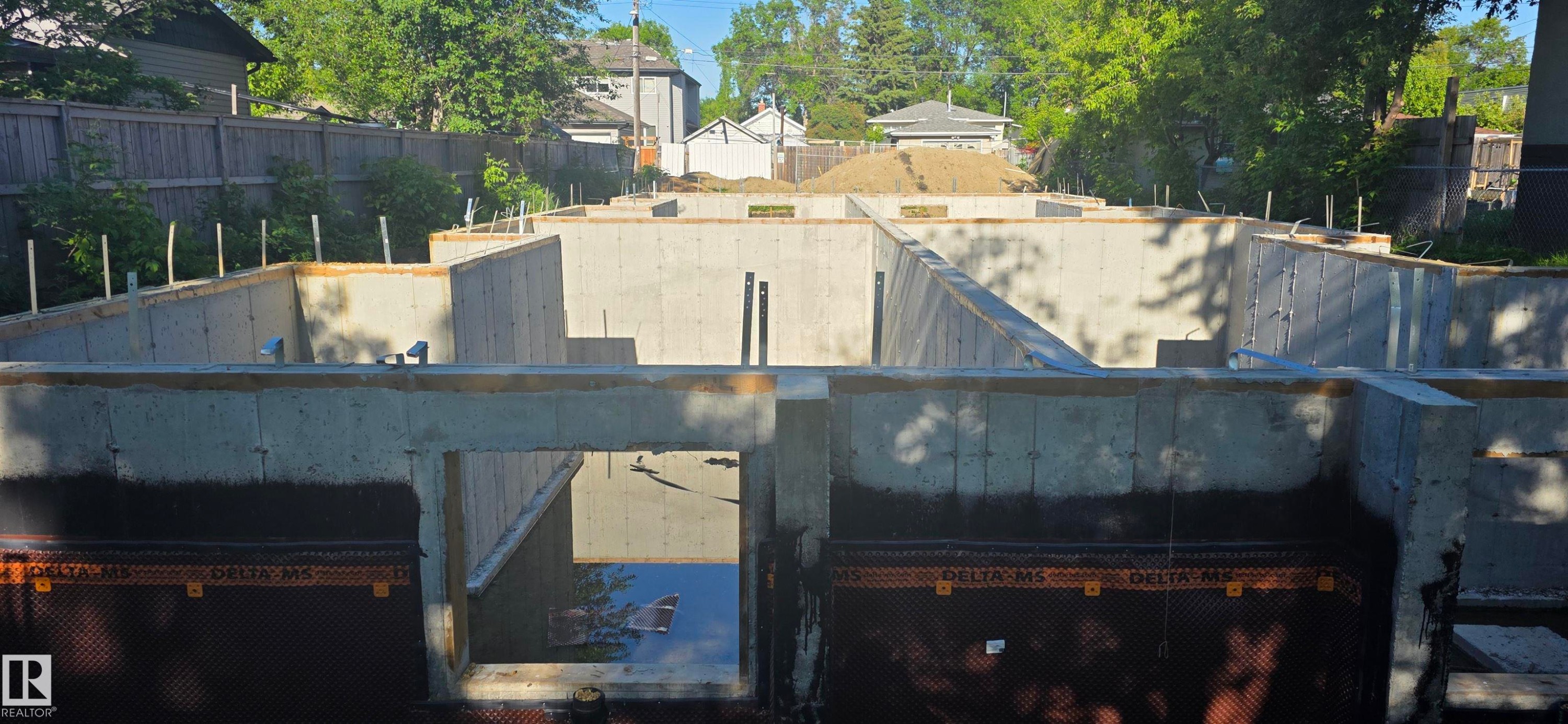 Newly poured concrete foundation featuring extensive waterproofing - 12929 71 Street, Edmonton, AB