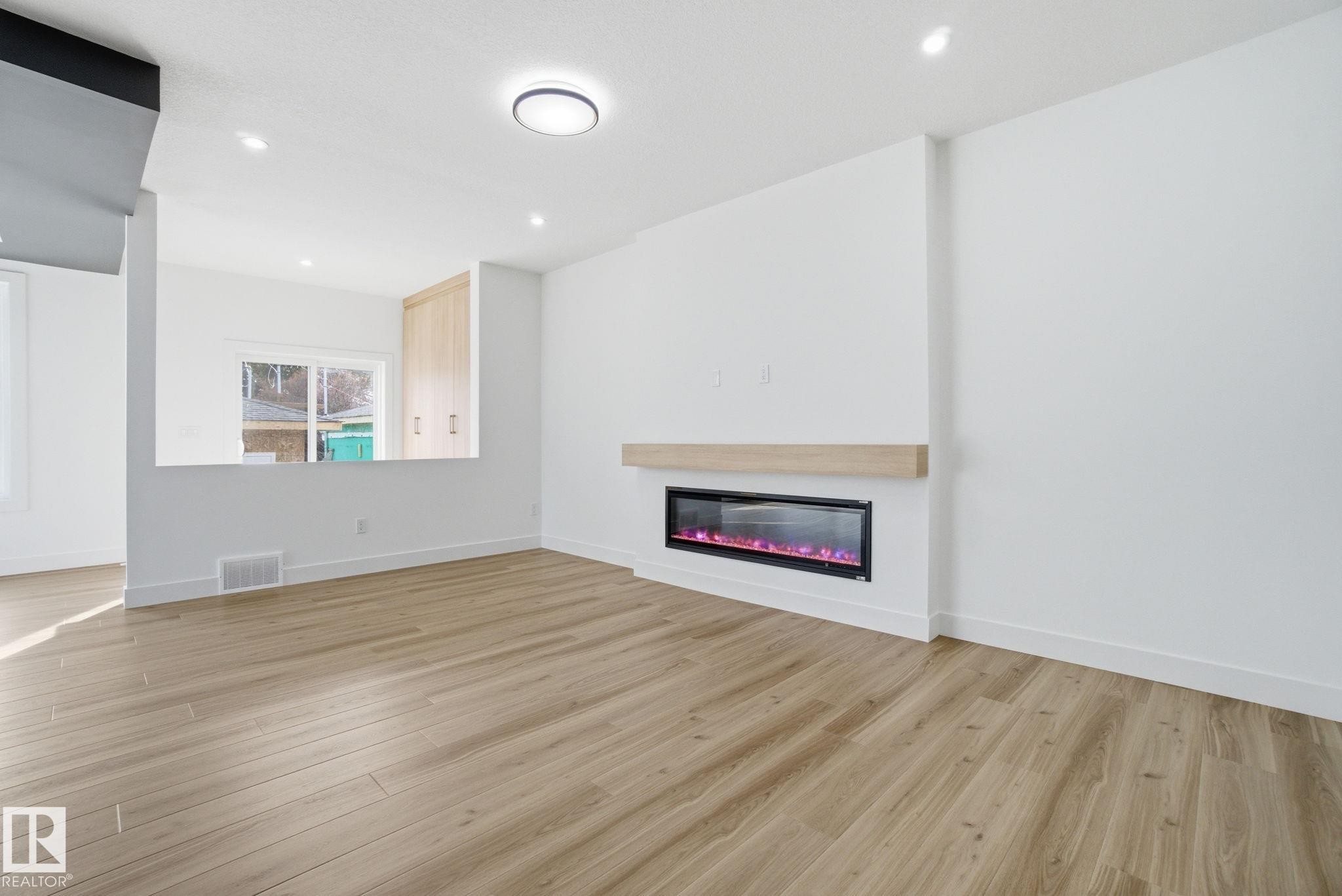 7603 92 Avenue Nw, Edmonton, AB - Indoor Photo Showing Other Room With Fireplace