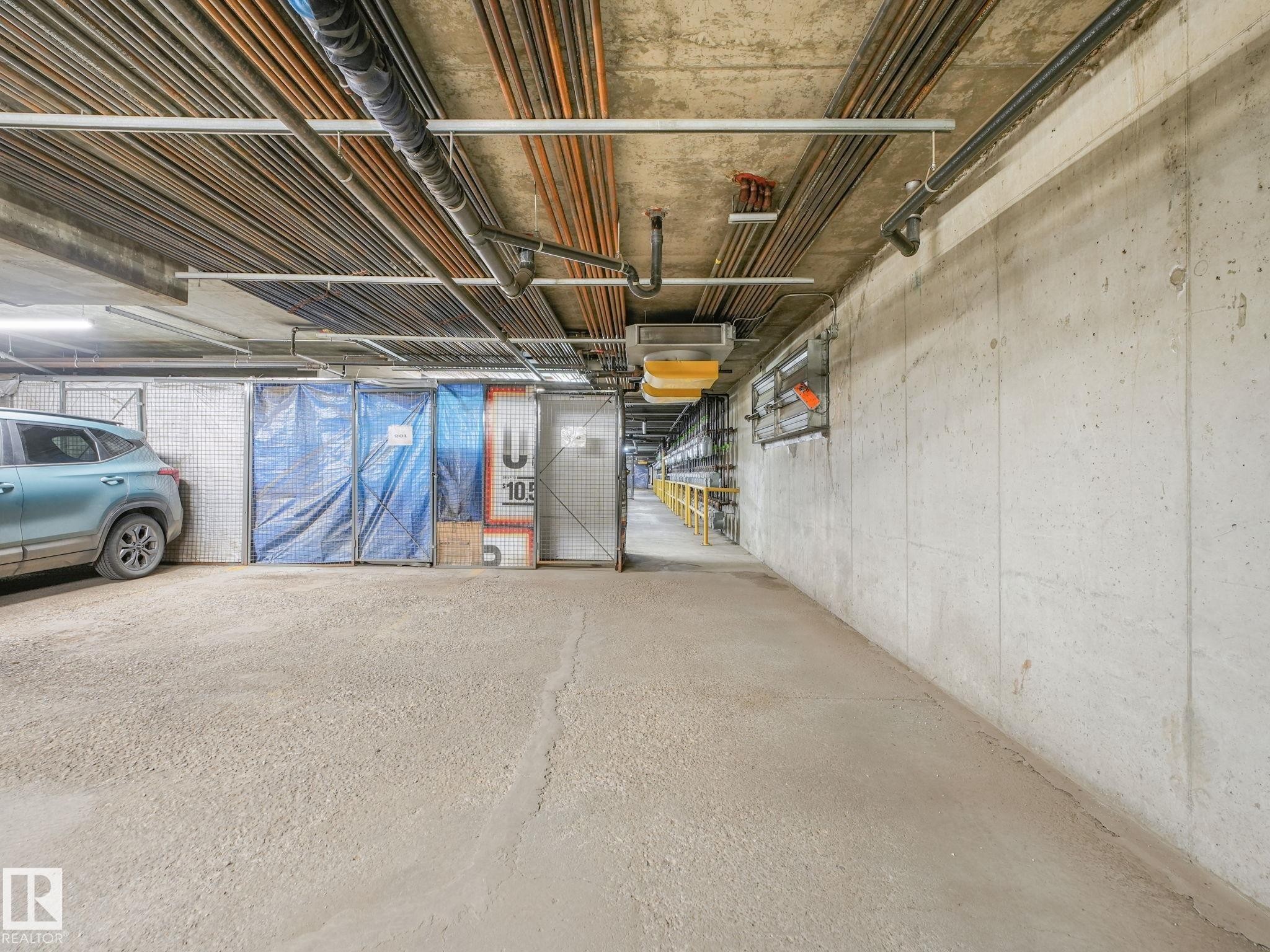 Concrete flooring and walls define this subterranean space - 150 4827 104A Street, Edmonton, AB