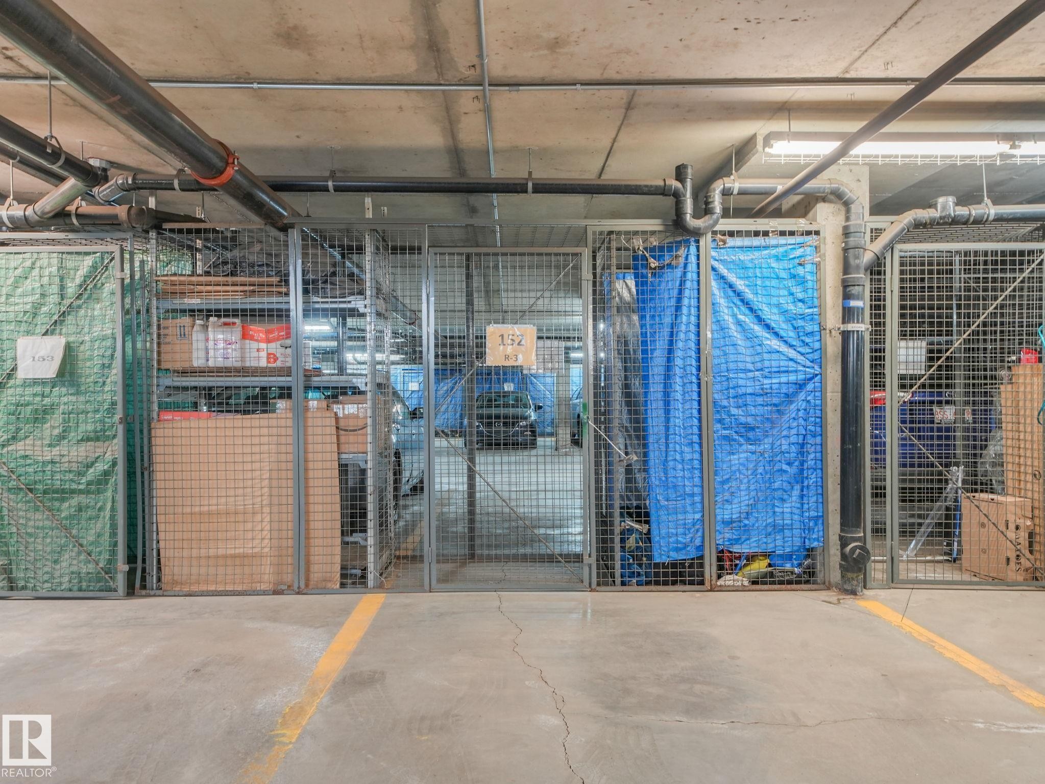 Dedicated storage units within a concrete-floored parking garage - 150 4827 104A Street, Edmonton, AB