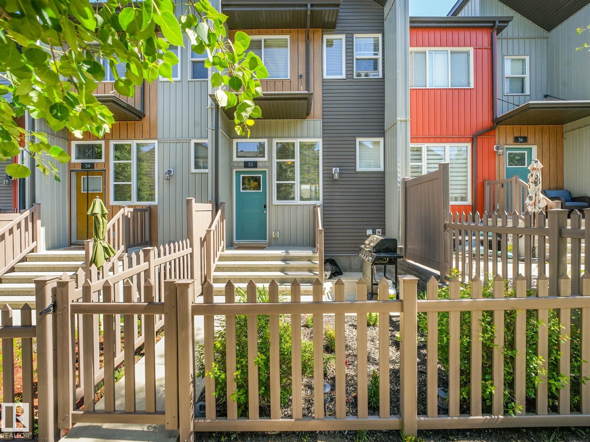 Contemporary townhome exterior featuring multi-level construction with varied siding materials - #55 4470 Prowse Rd Sw, Edmonton, AB - Outdoor With Deck Patio Veranda