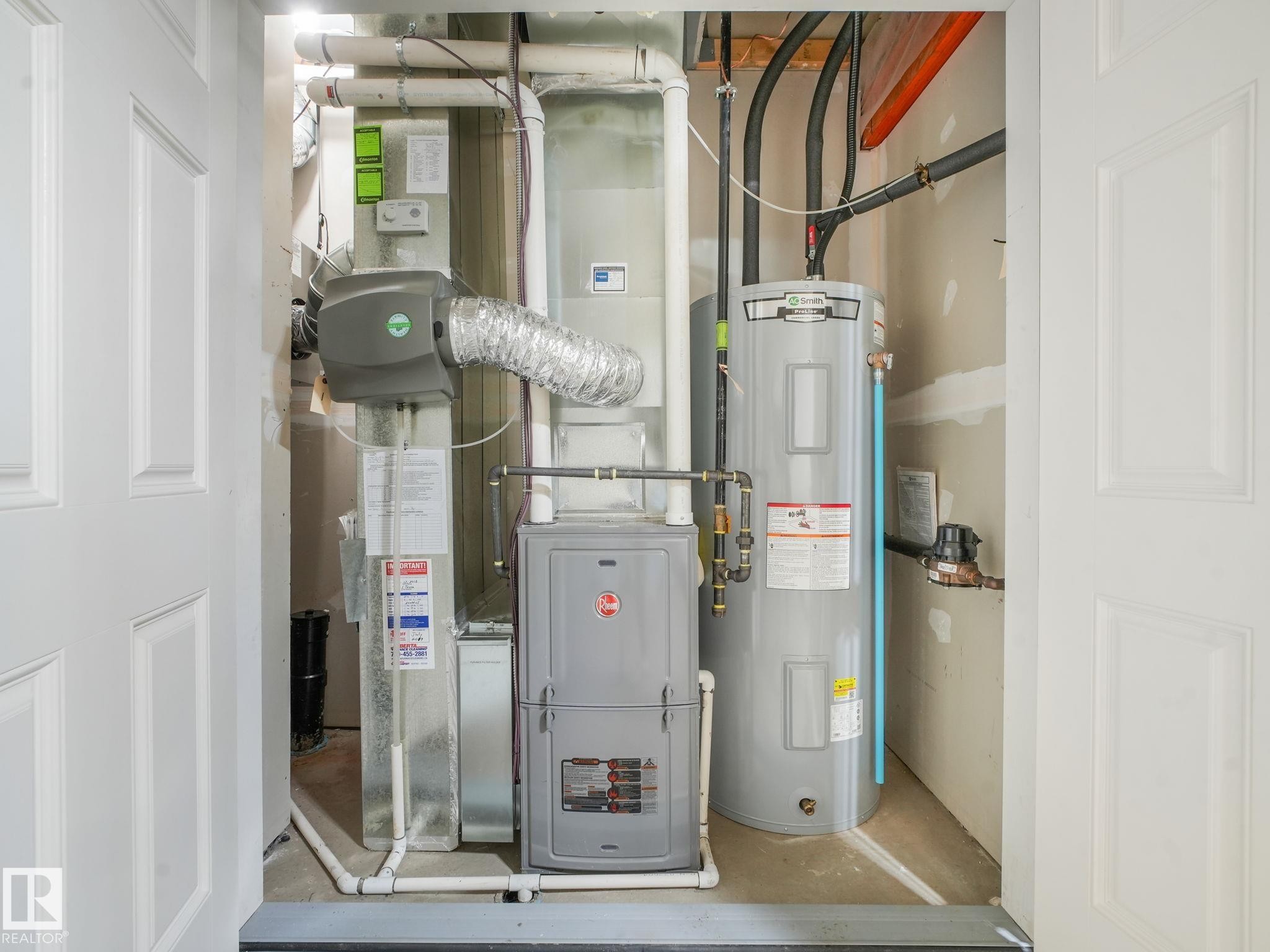 Mechanical closet housing HVAC system, water heater, and associated plumbing/ducting - #55 4470 Prowse Rd Sw, Edmonton, AB - Indoor Photo Showing Basement