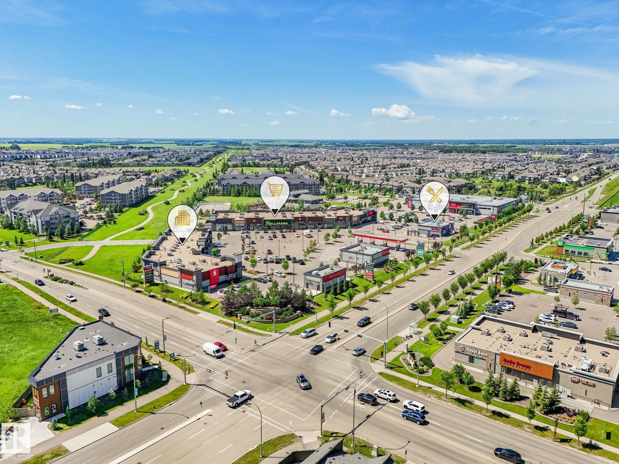 Aerial perspective showcasing a commercial development with multiple businesses - #55 4470 Prowse Rd Sw, Edmonton, AB - Outdoor With View