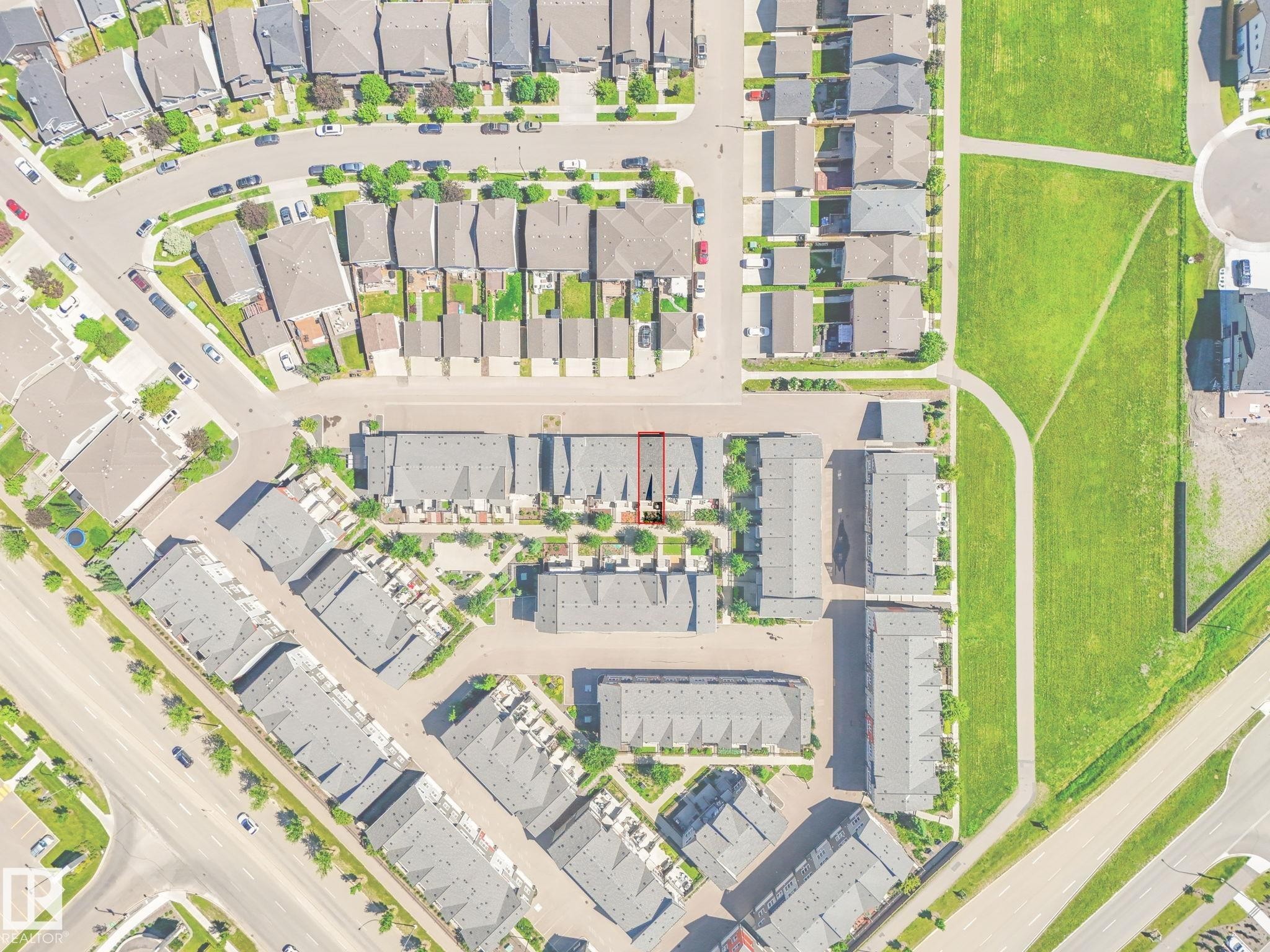 Aerial perspective of a structured residential area featuring rows of townhomes and detached properties - #55 4470 Prowse Rd Sw, Edmonton, AB - Other