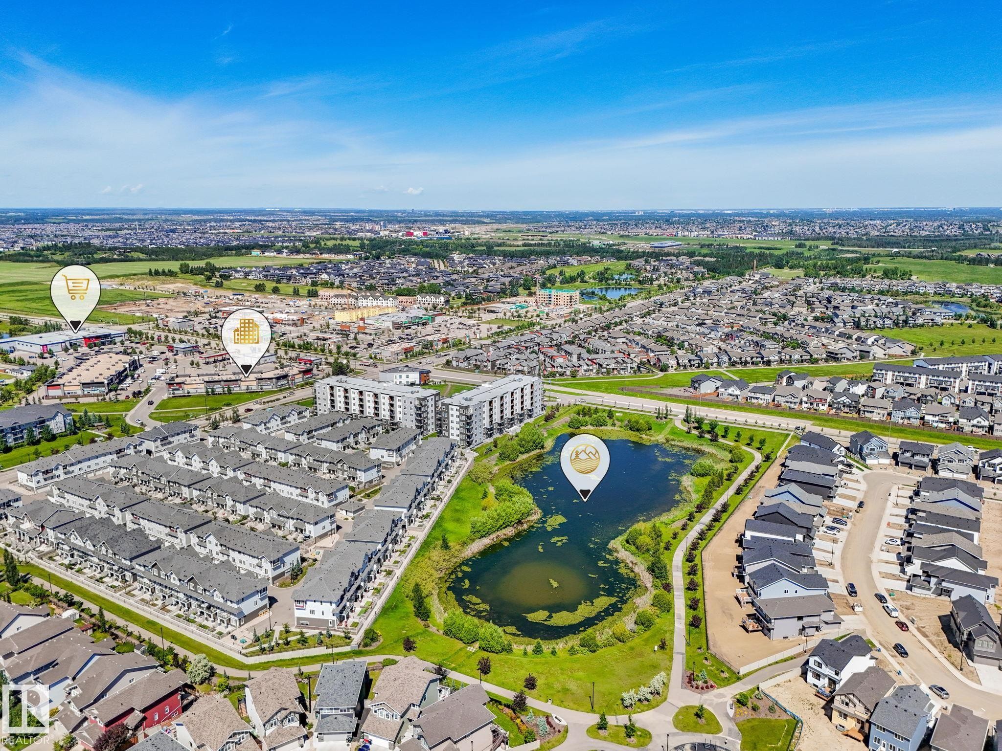 Aerial overview of a residential community featuring a variety of housing types - #55 4470 Prowse Rd Sw, Edmonton, AB - Outdoor With View