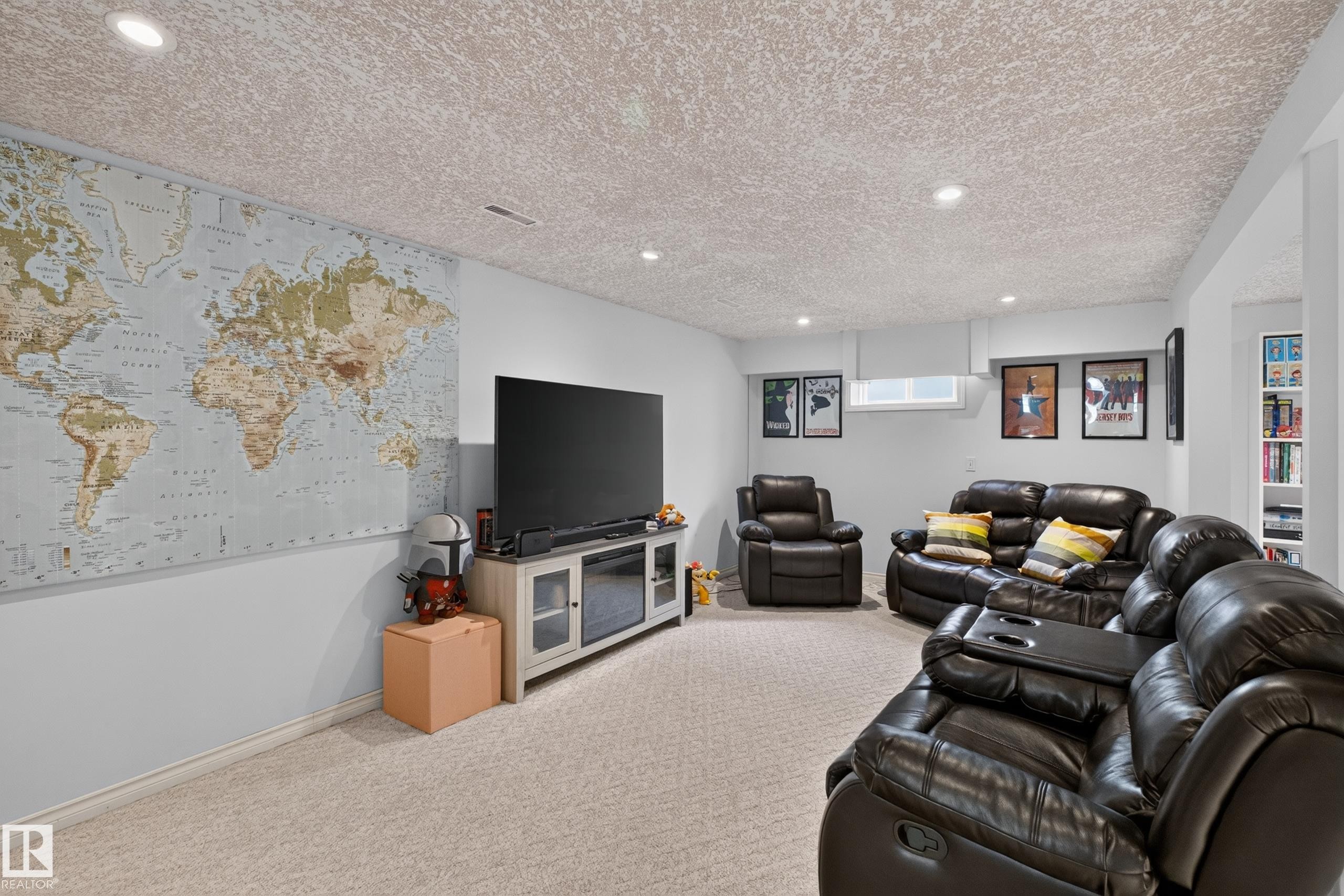 Finished lower level featuring recessed lighting, light-colored carpeting, a window, and built-in shelving - 11015 122 Street, Edmonton, AB