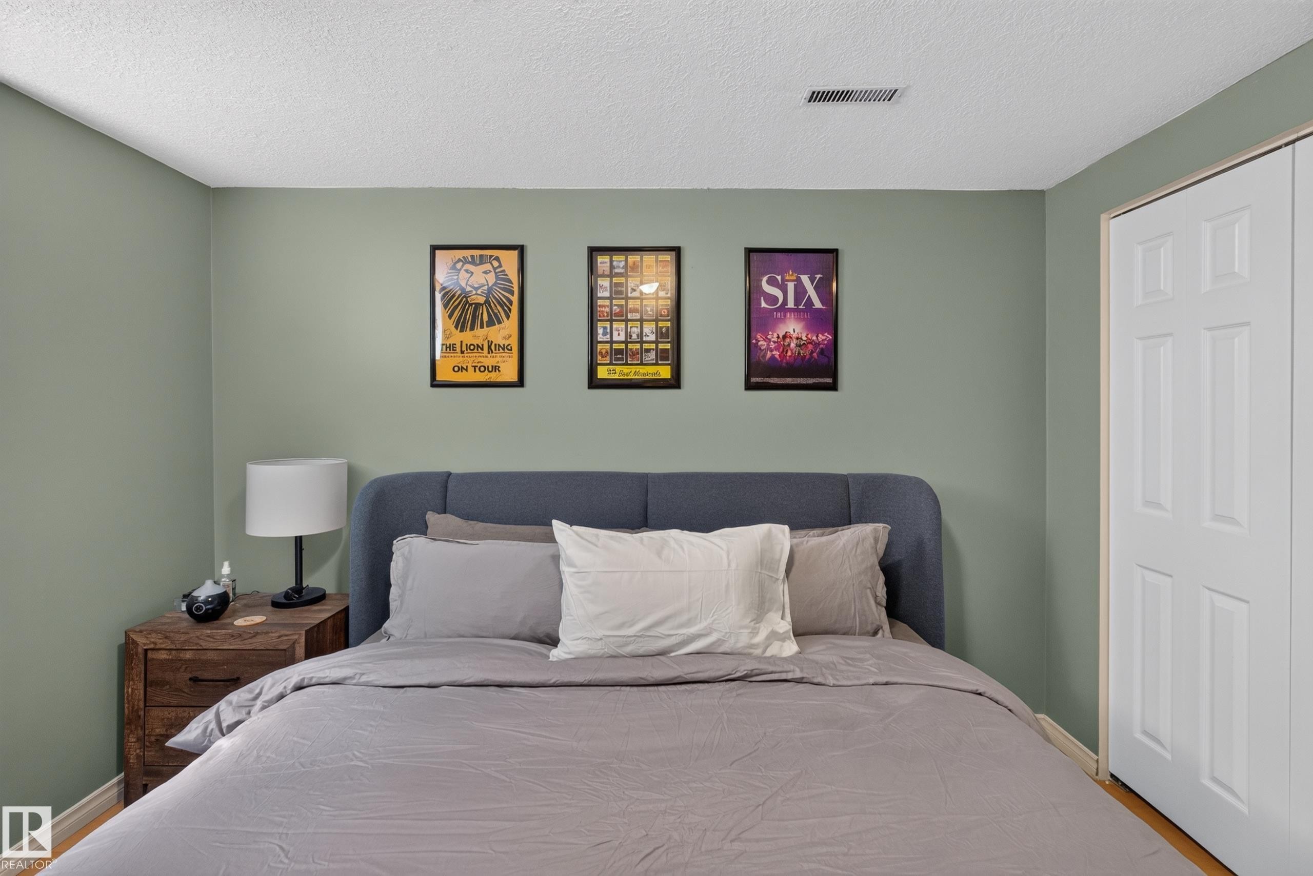 Neutral-toned wall paint complements the light wood-finish flooring - 11015 122 Street, Edmonton, AB